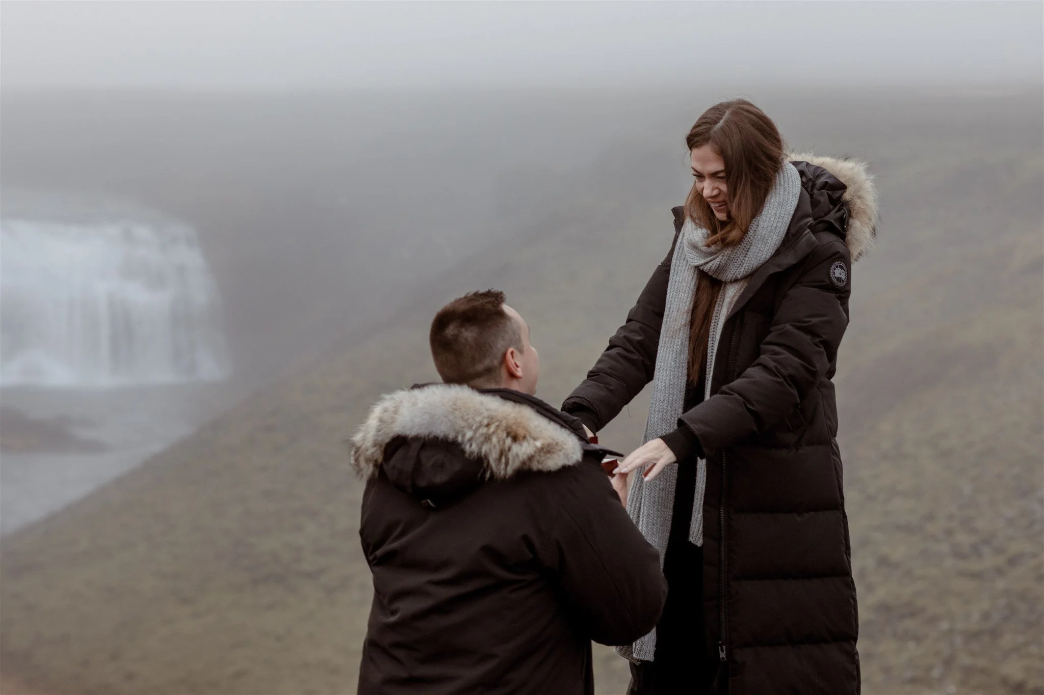  Secret Iceland Proposal at a Foggy Winter Waterfall by a local Iceland Engagement &amp; Proposal Photographer and planner —she said yes 