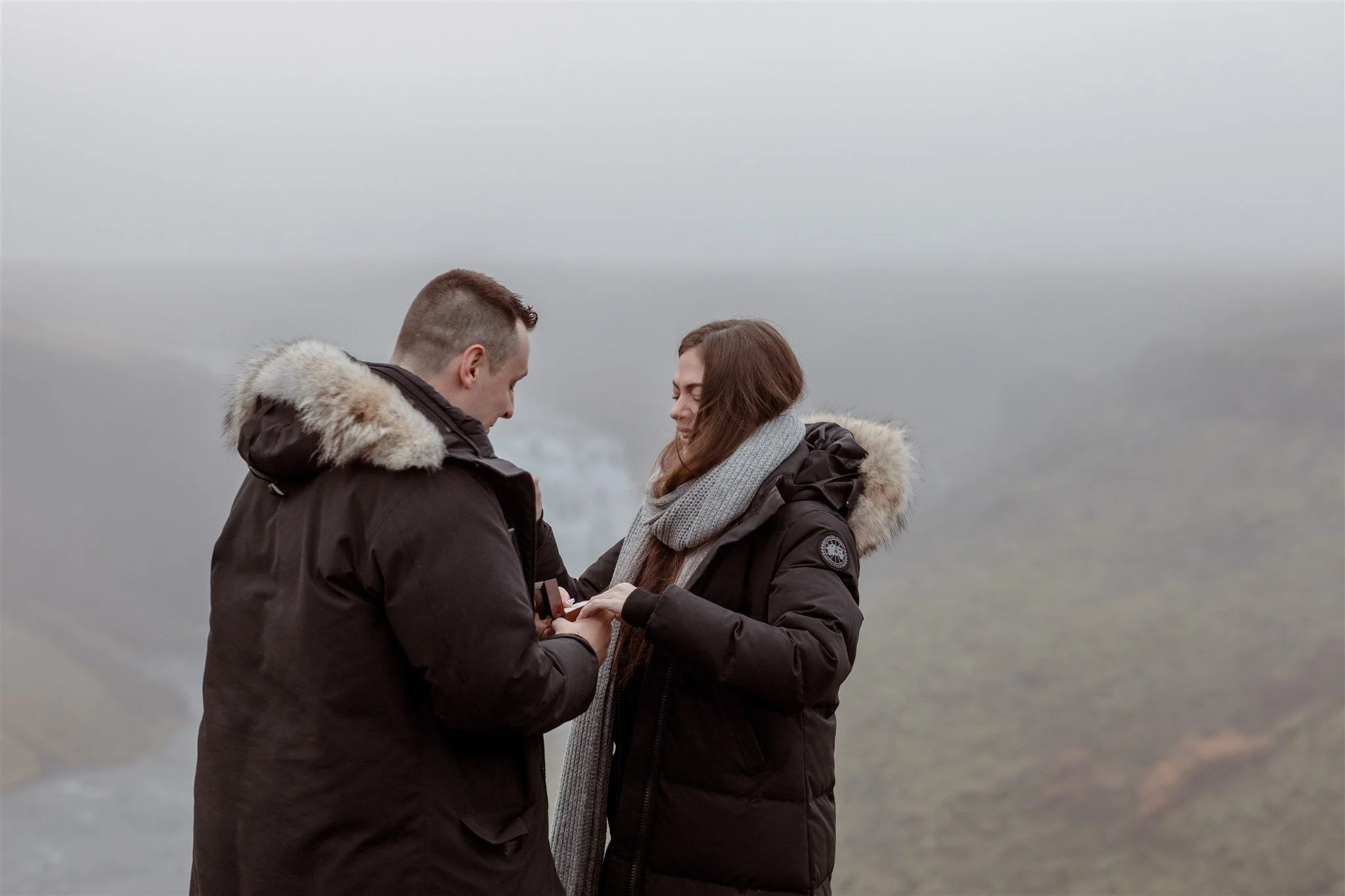 Secret Iceland Proposal at a Foggy Winter Waterfall by a local Iceland Engagement &amp; Proposal Photographer and planner —she said yes 