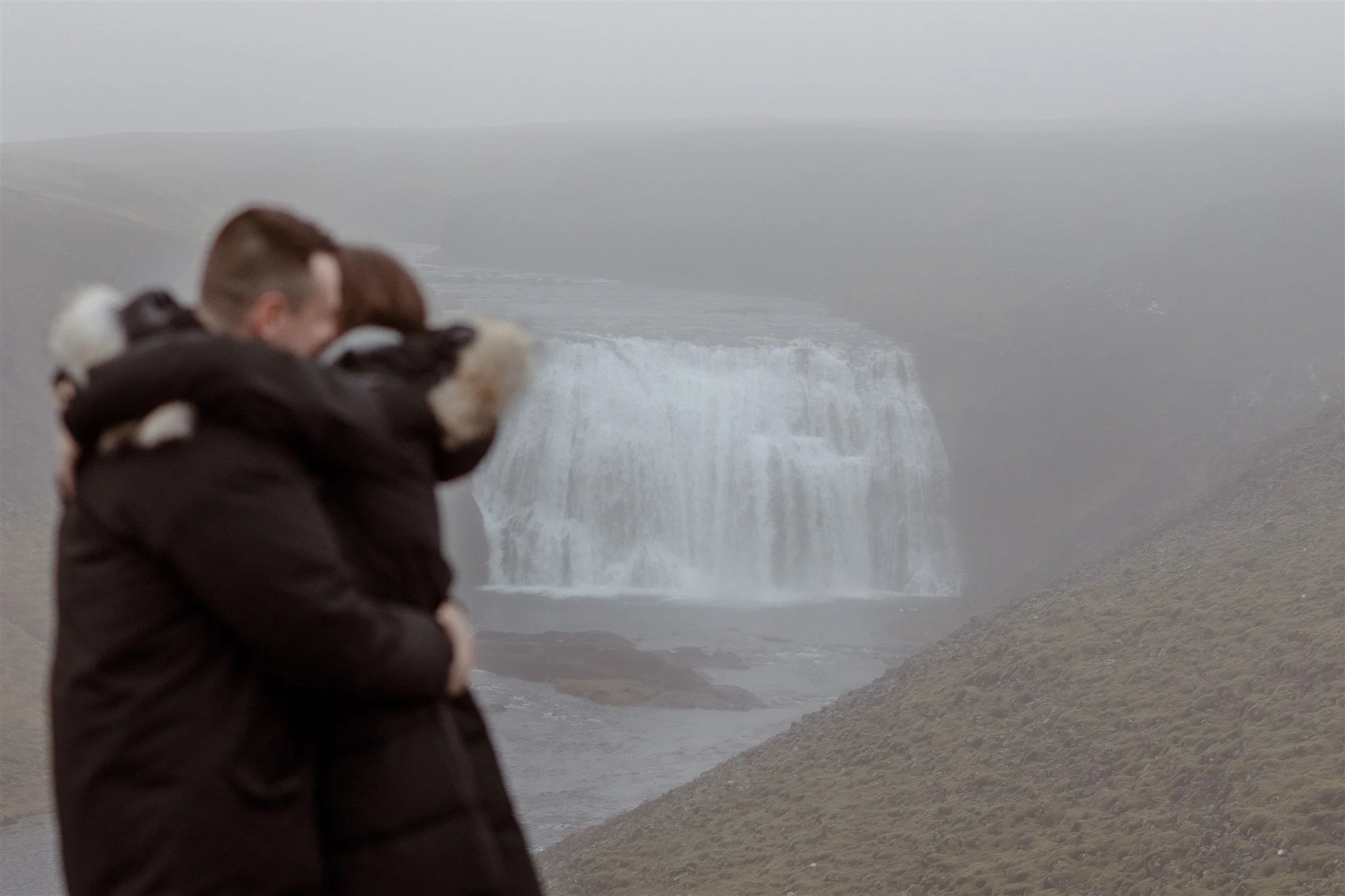  Secret Iceland Proposal at a Foggy Winter Waterfall by a local Iceland Engagement &amp; Proposal Photographer and planner —she said yes 