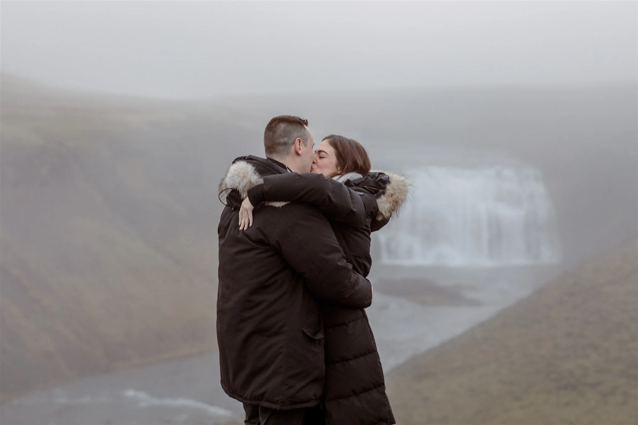  Secret Iceland Proposal at a Foggy Winter Waterfall by a local Iceland Engagement &amp; Proposal Photographer and planner —she said yes 