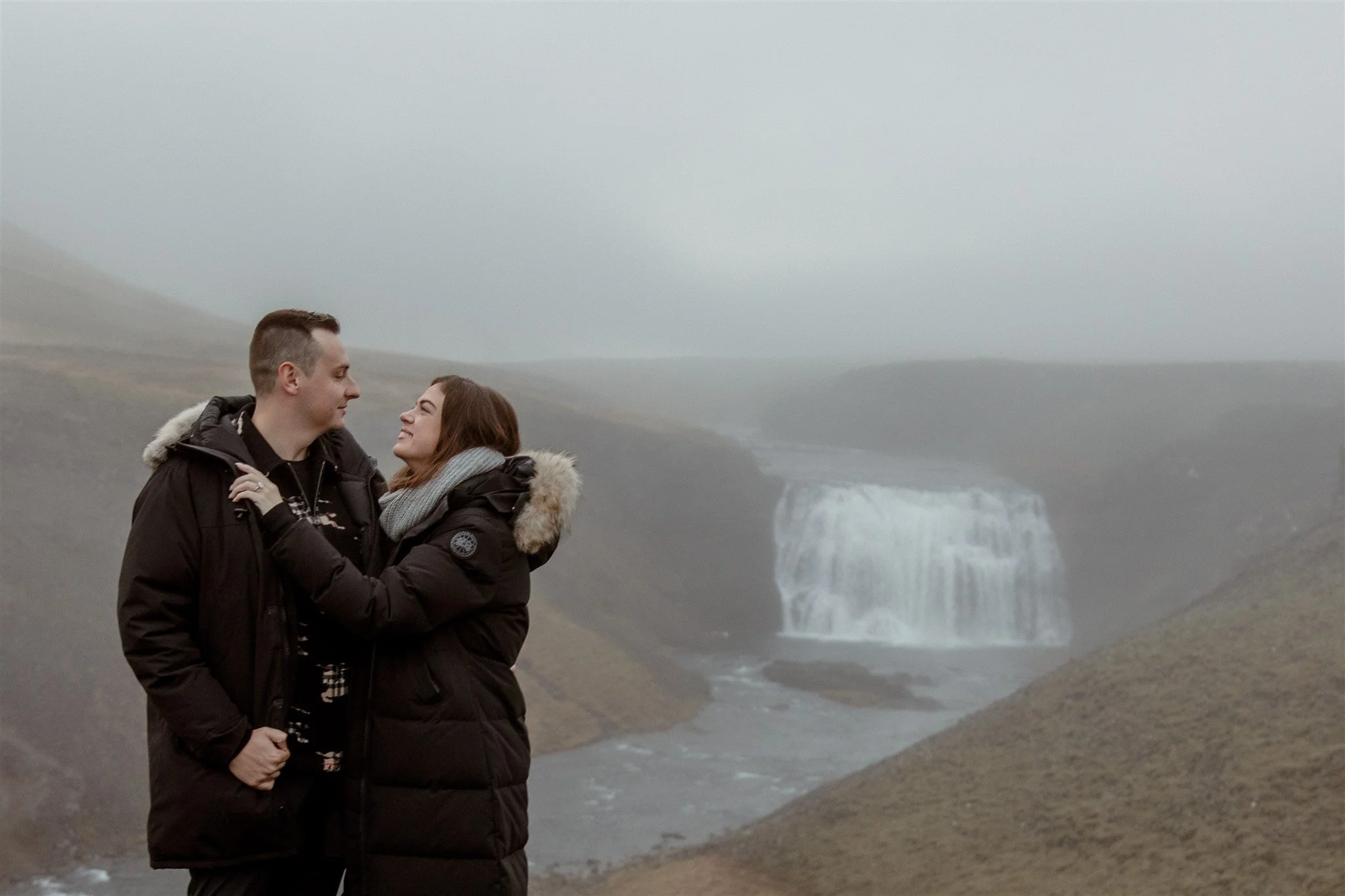  Secret Iceland Proposal at a Foggy Winter Waterfall by a local Iceland Engagement &amp; Proposal Photographer and planner —couple at waterfall 