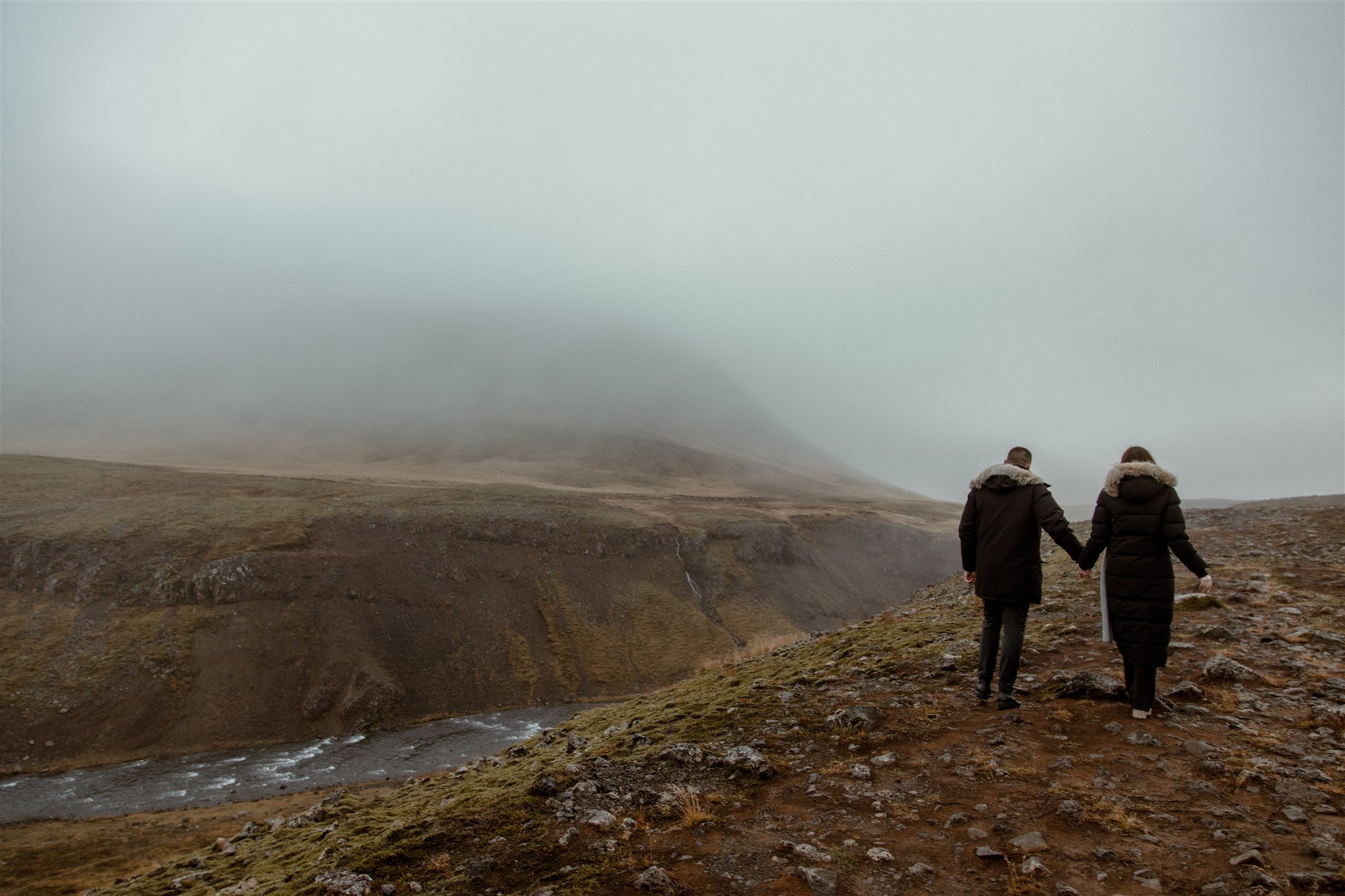  Secret Iceland Proposal at a Foggy Winter Waterfall by a local Iceland Engagement &amp; Proposal Photographer and planner —couple at waterfall 