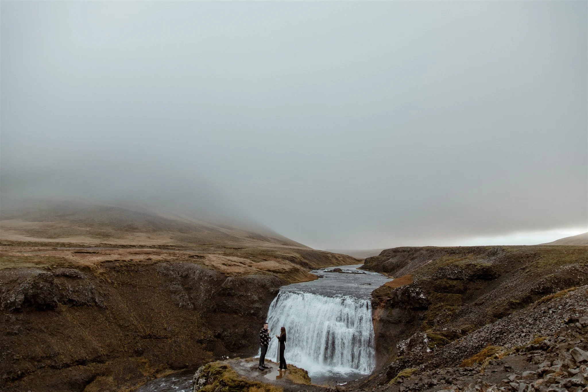  Secret Iceland Proposal at a Foggy Winter Waterfall by a local Iceland Engagement &amp; Proposal Photographer and planner —couple at waterfall 