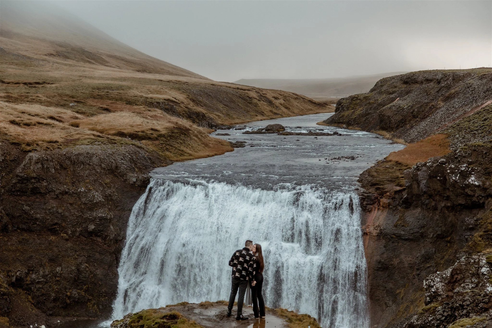  Secret Iceland Proposal at a Foggy Winter Waterfall by a local Iceland Engagement &amp; Proposal Photographer and planner —couple at waterfall 