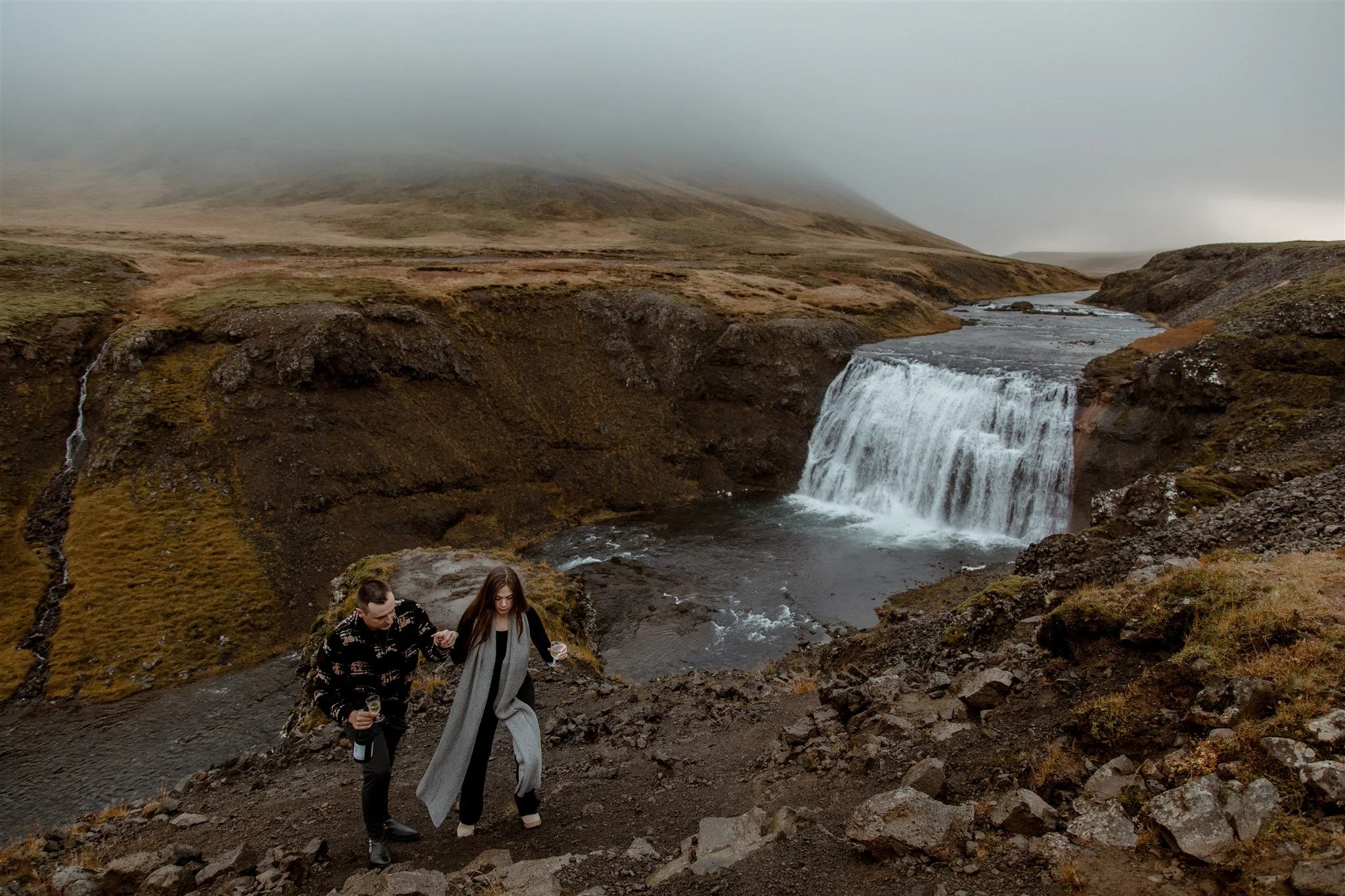  Secret Iceland Proposal at a Foggy Winter Waterfall by a local Iceland Engagement &amp; Proposal Photographer and planner —couple at waterfall 