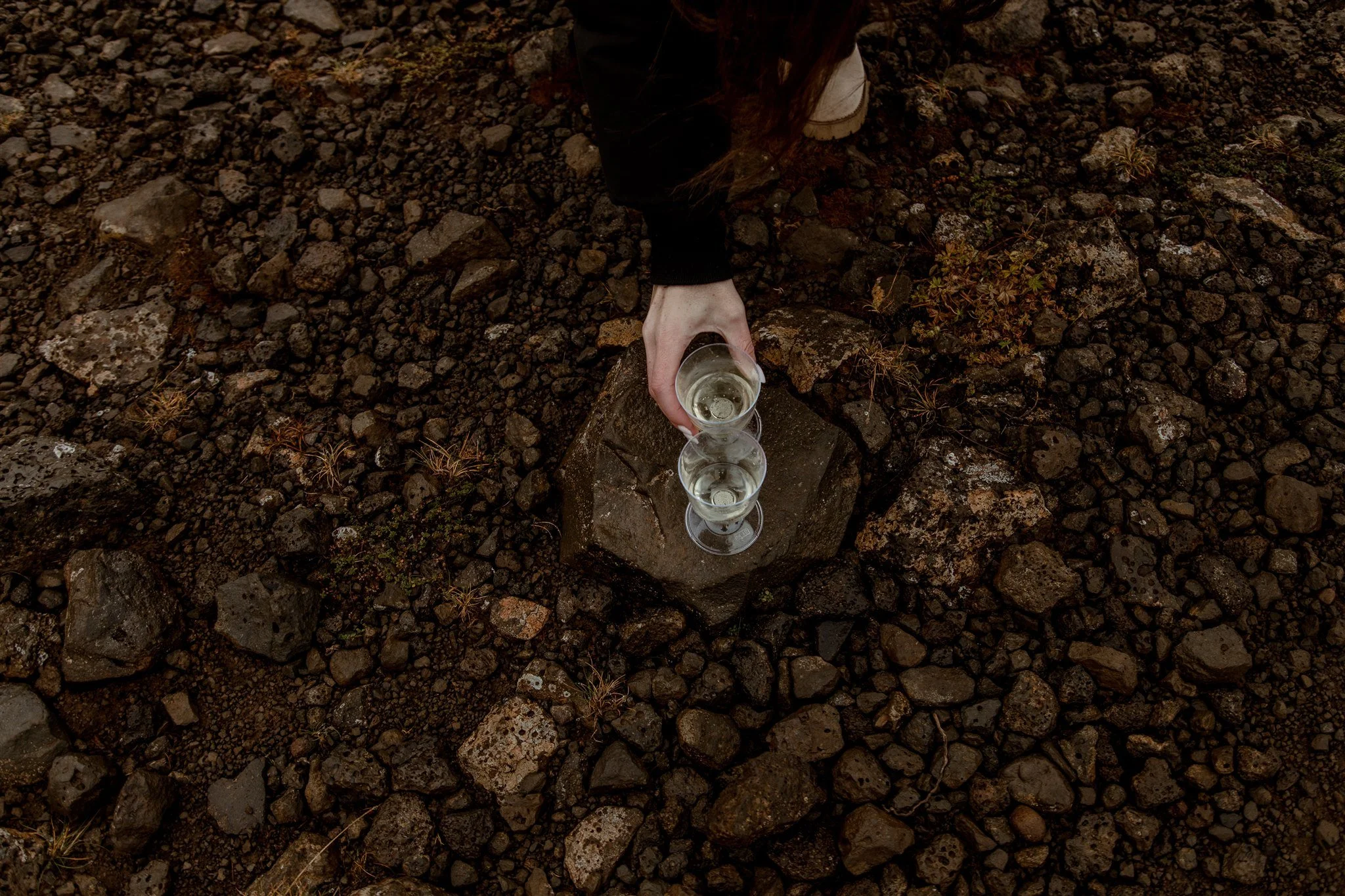  Secret Iceland Proposal at a Foggy Winter Waterfall by a local Iceland Engagement &amp; Proposal Photographer and planner —couple at waterfall with champagne 