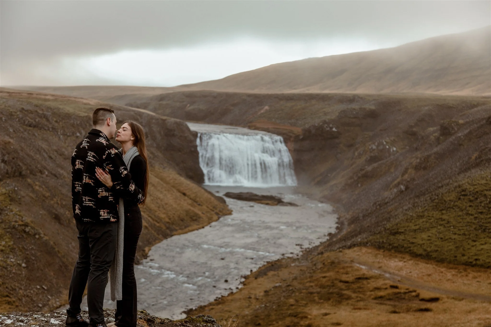  Secret Iceland Proposal at a Foggy Winter Waterfall by a local Iceland Engagement &amp; Proposal Photographer and planner —couple at waterfall 