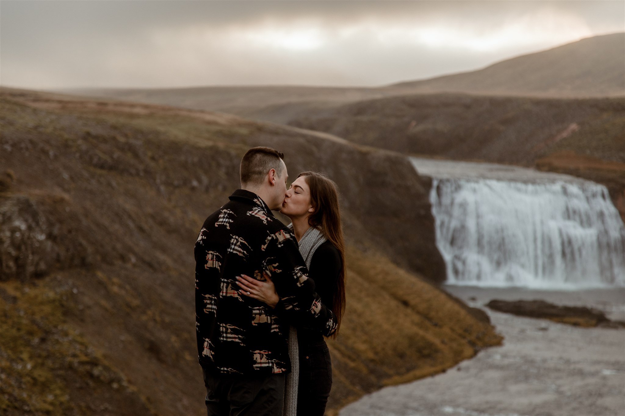  Secret Iceland Proposal at a Foggy Winter Waterfall by a local Iceland Engagement &amp; Proposal Photographer and planner —couple at waterfall 