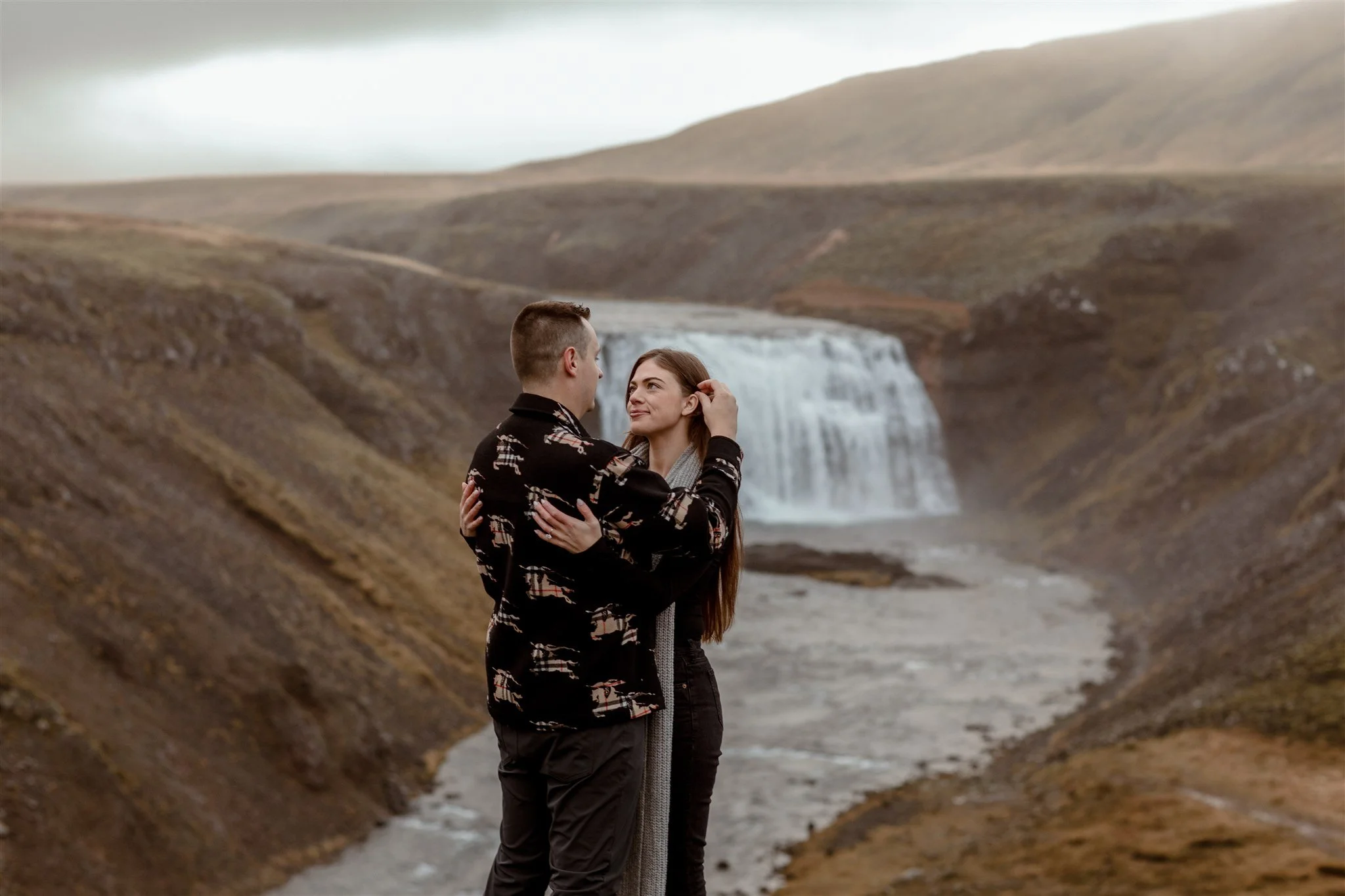  Secret Iceland Proposal at a Foggy Winter Waterfall by a local Iceland Engagement &amp; Proposal Photographer and planner —couple at waterfall 