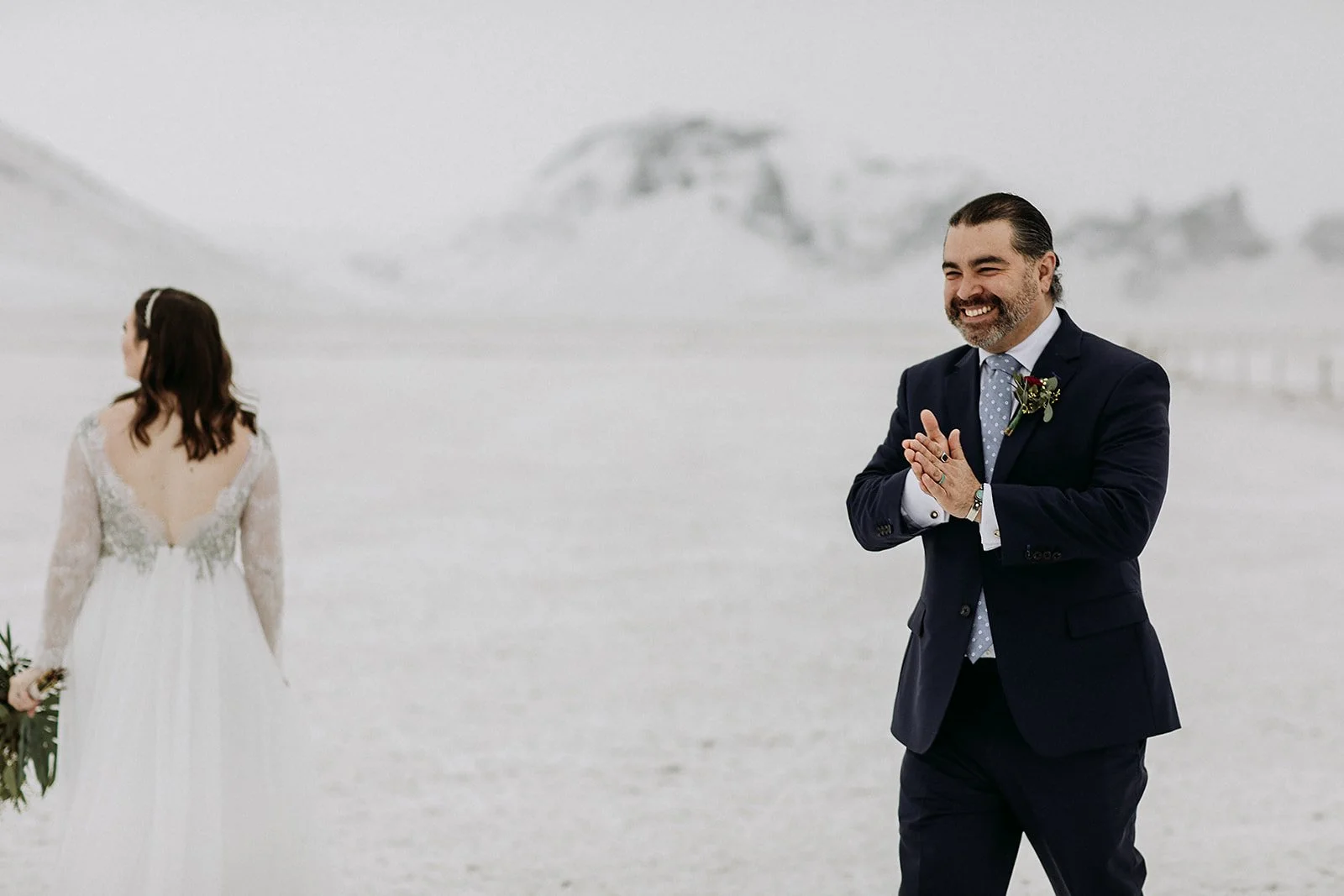 A Winter Iceland Elopement at Skógafoss (Skogafoss) and Glacier — couple in snowy field