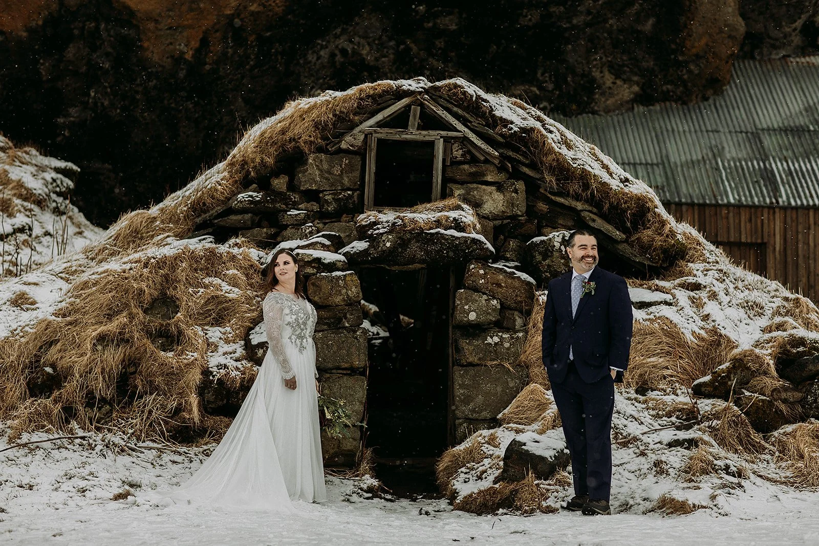 A Winter Iceland Elopement at Skógafoss (Skogafoss) and Glacier — couple in snowy field