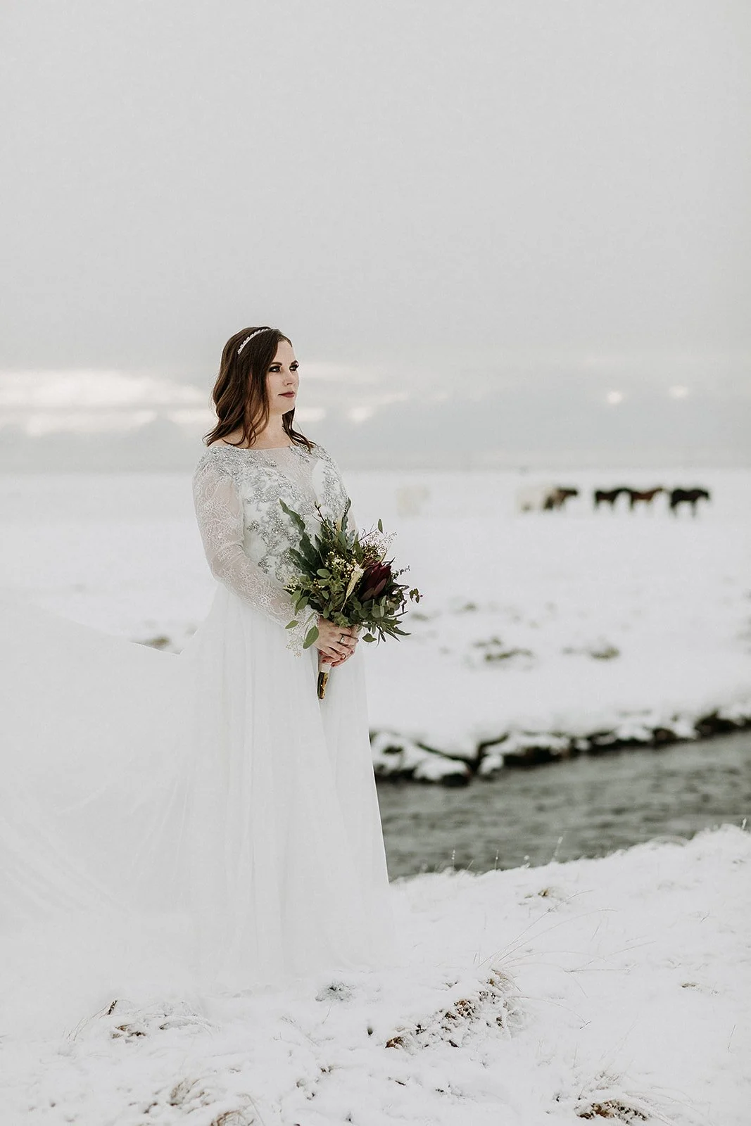 A Winter Iceland Elopement at Skógafoss (Skogafoss) and Glacier — couple in snowy field