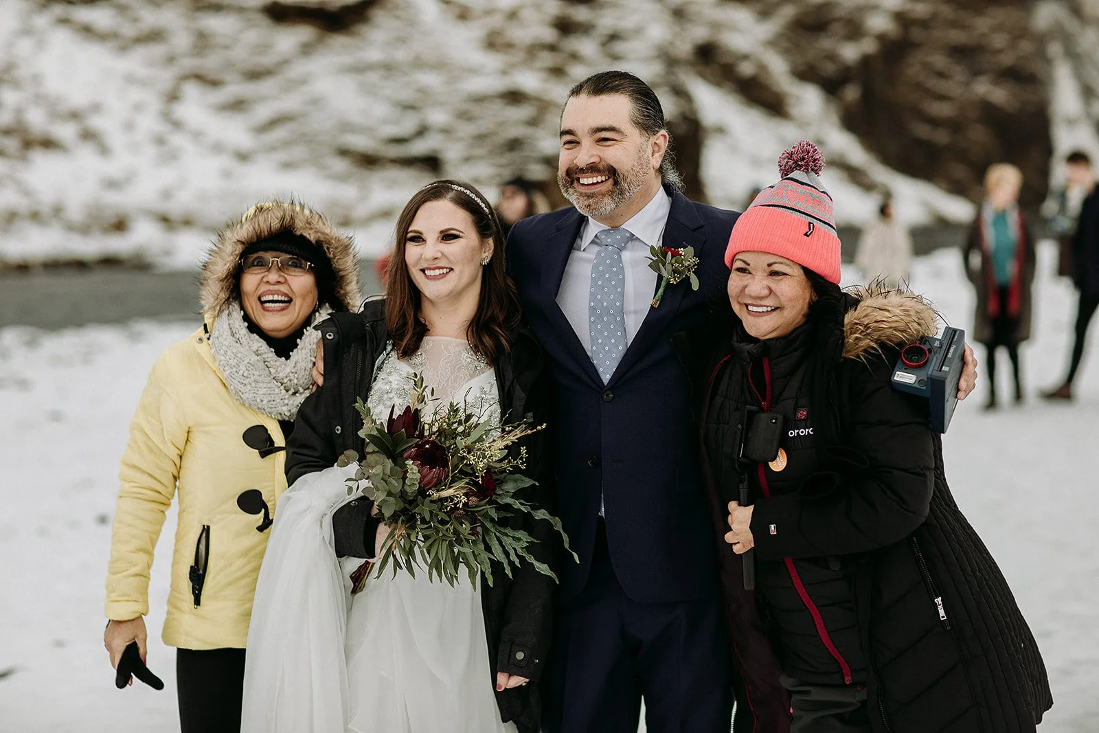 A Winter Iceland Elopement at Skógafoss (Skogafoss) and Glacier — couple at waterfall