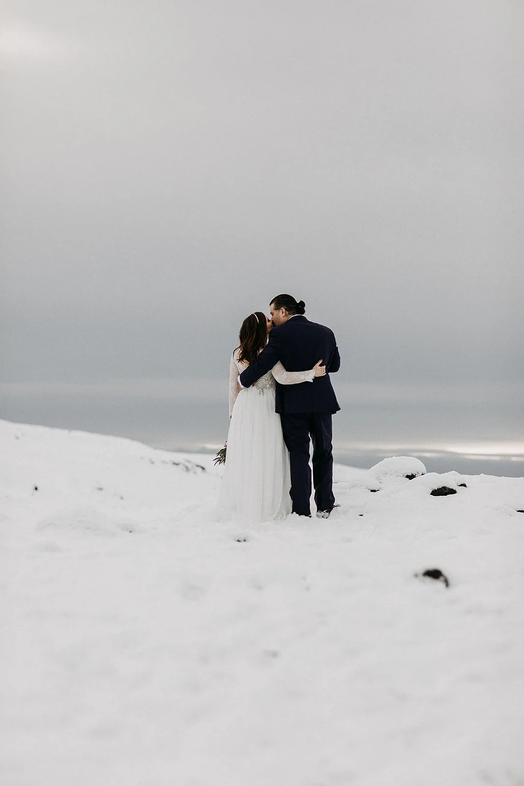 A Winter Iceland Elopement at Skógafoss (Skogafoss) and Glacier — couple at glacier