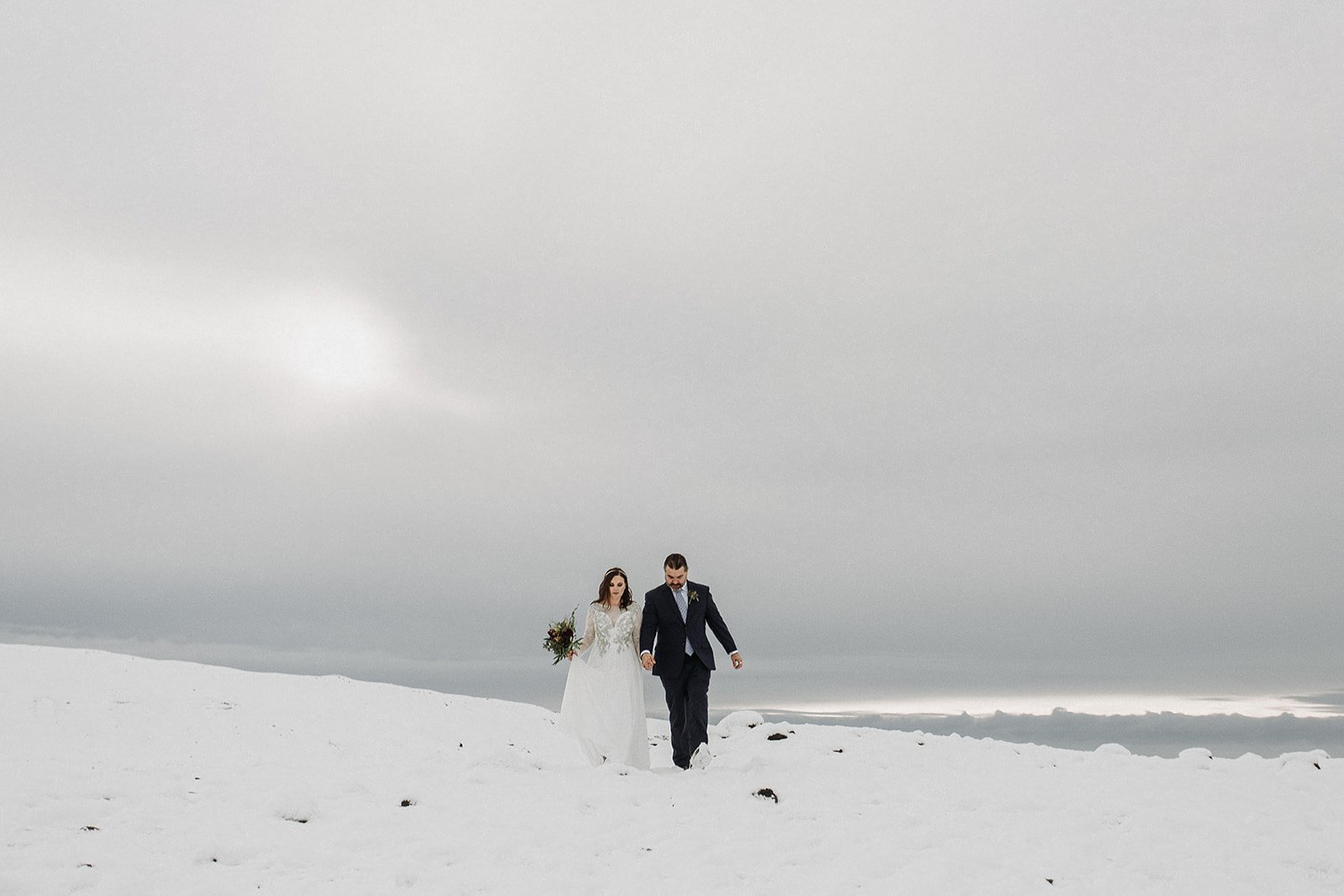 A Winter Iceland Elopement at Skógafoss (Skogafoss) and Glacier — couple at glacier