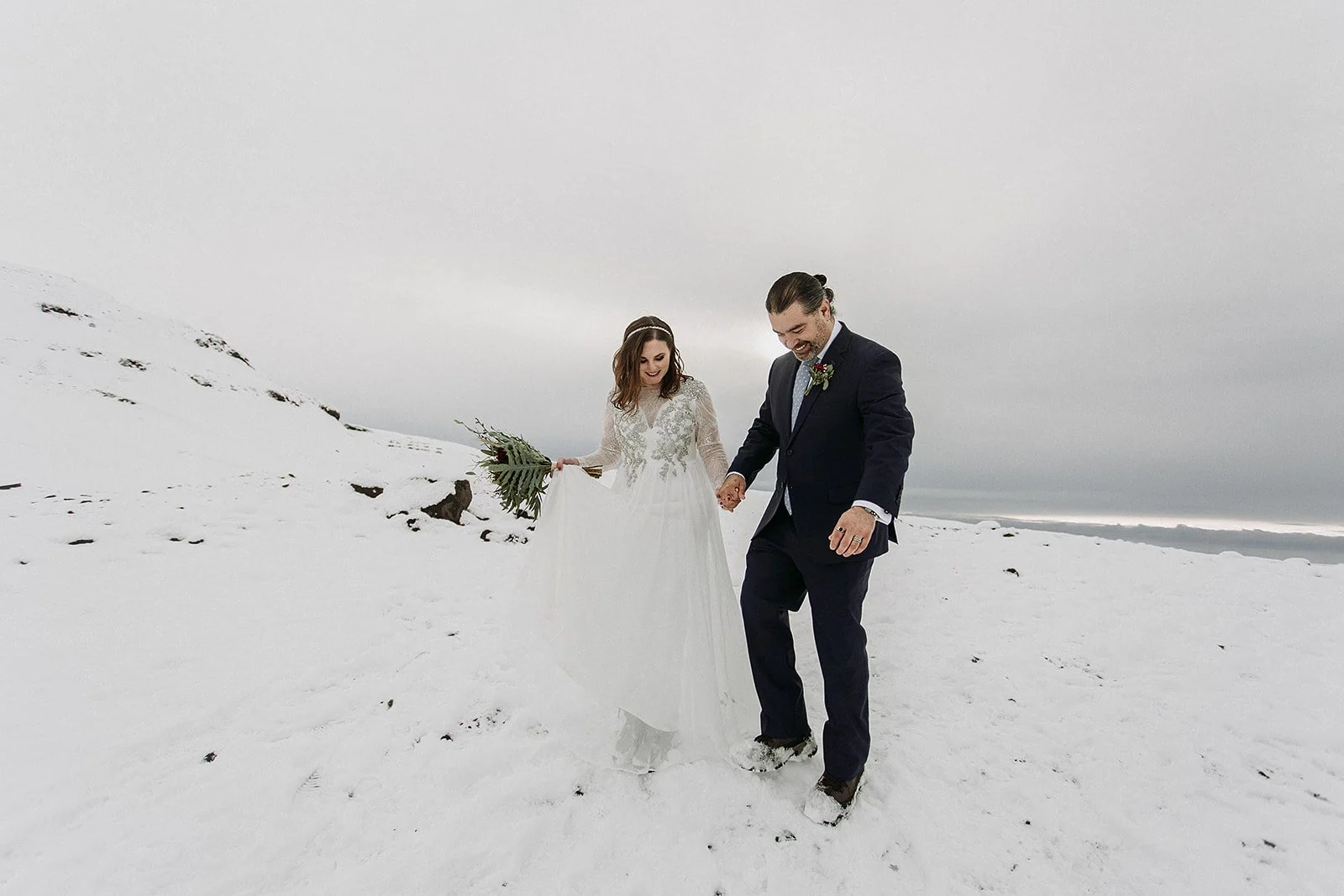 A Winter Iceland Elopement at Skógafoss (Skogafoss) and Glacier — couple at glacier