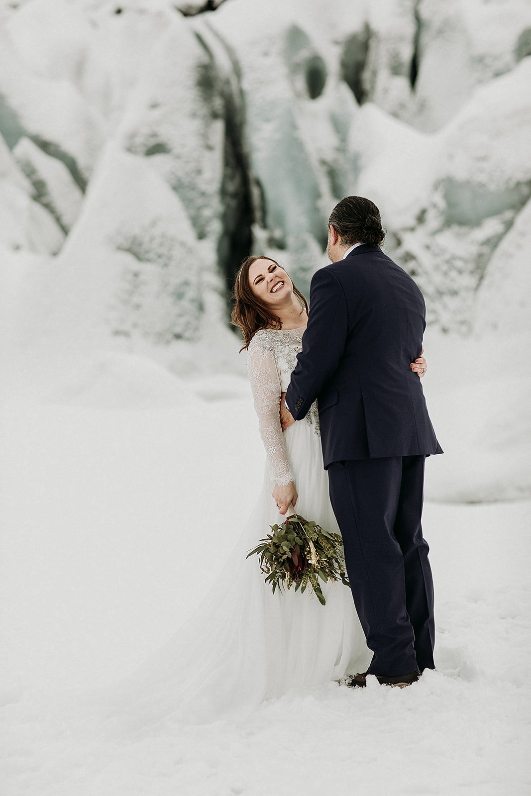 A Winter Iceland Elopement at Skógafoss (Skogafoss) and Glacier — couple at glacier