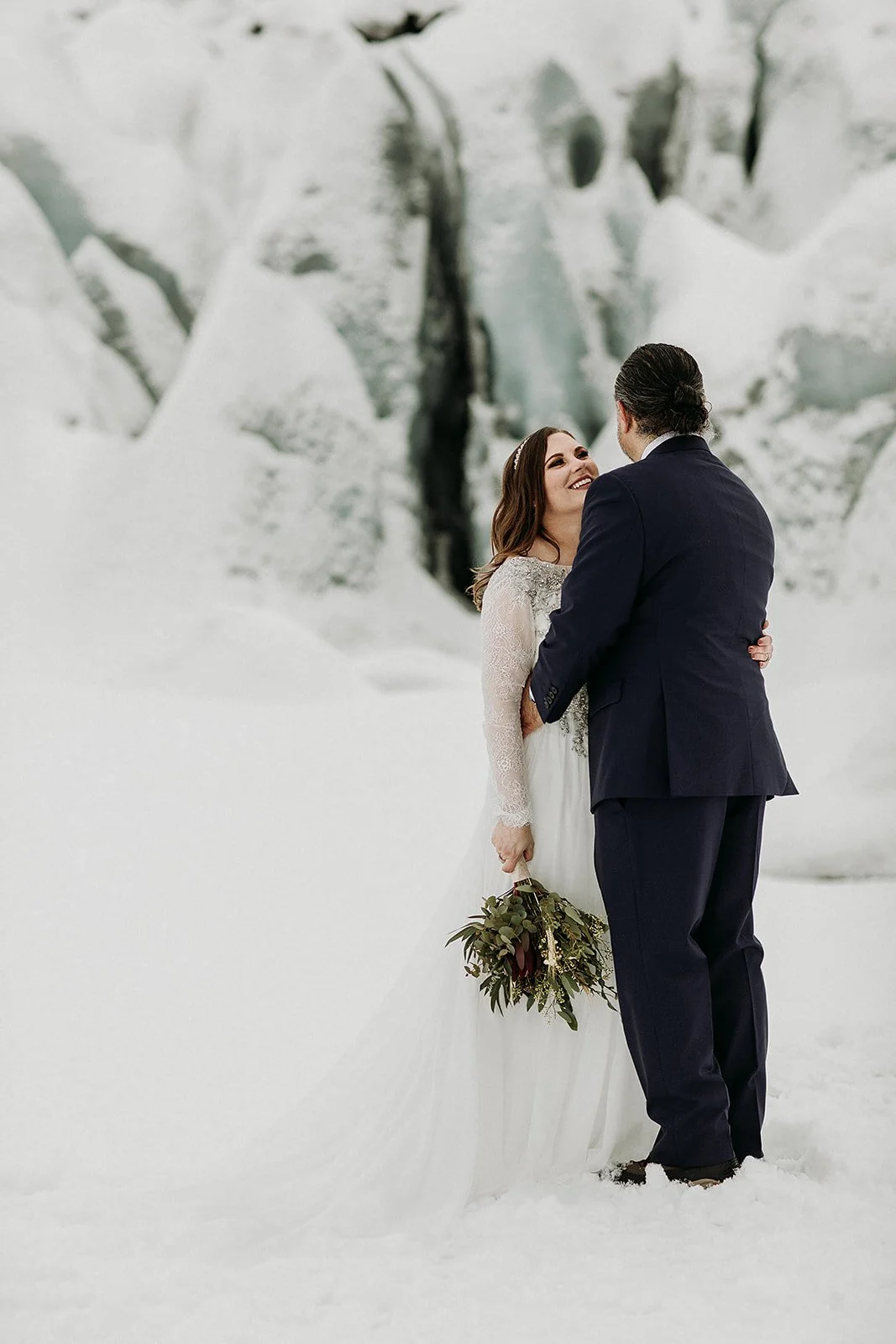 A Winter Iceland Elopement at Skógafoss (Skogafoss) and Glacier — couple at glacier