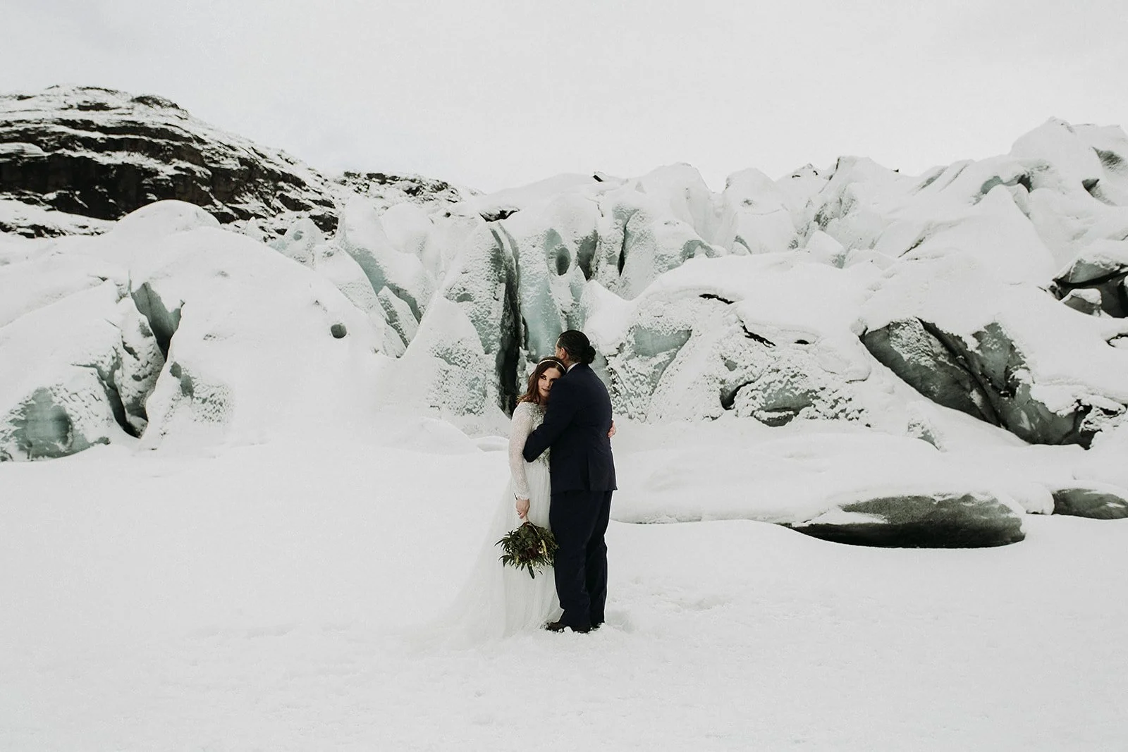 A Winter Iceland Elopement at Skógafoss (Skogafoss) and Glacier — couple at glacier