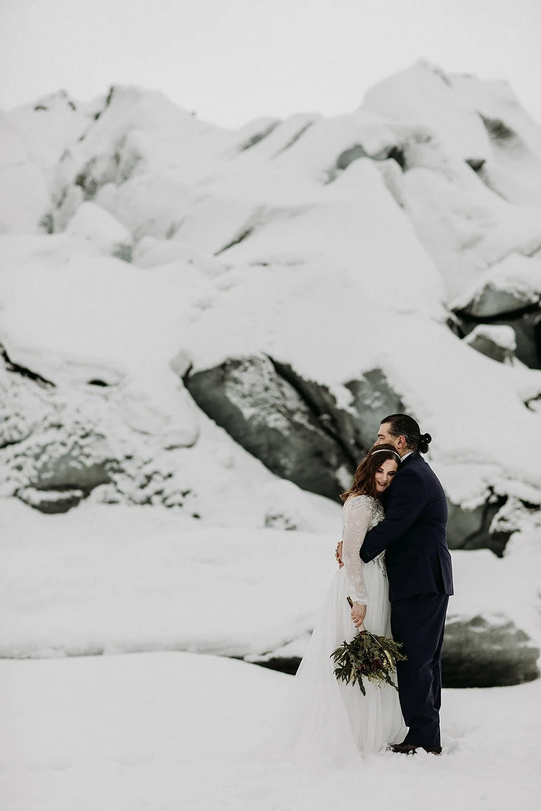A Winter Iceland Elopement at Skógafoss (Skogafoss) and Glacier — couple at glacier