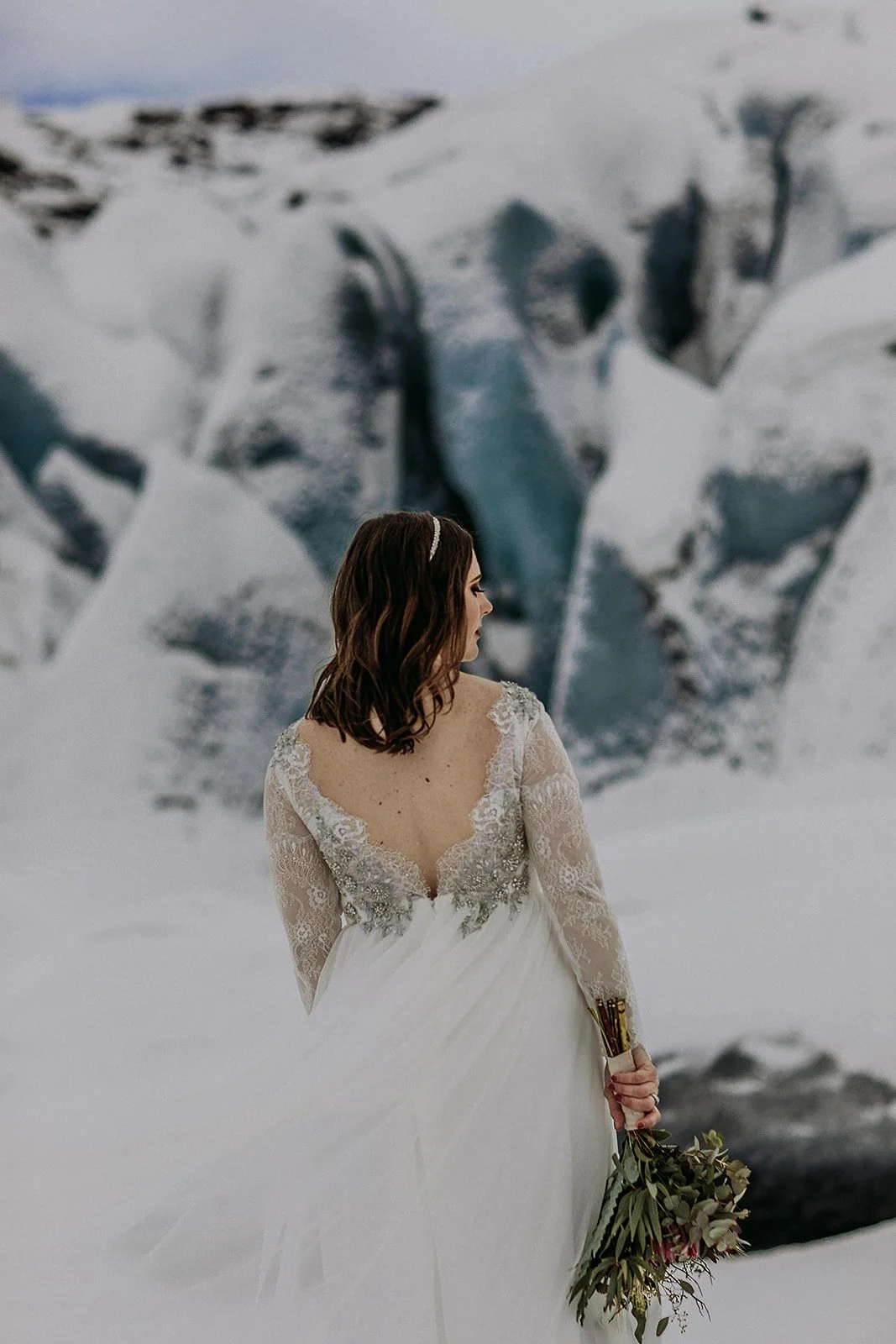 A Winter Iceland Elopement at Skógafoss (Skogafoss) and Glacier — couple at glacier