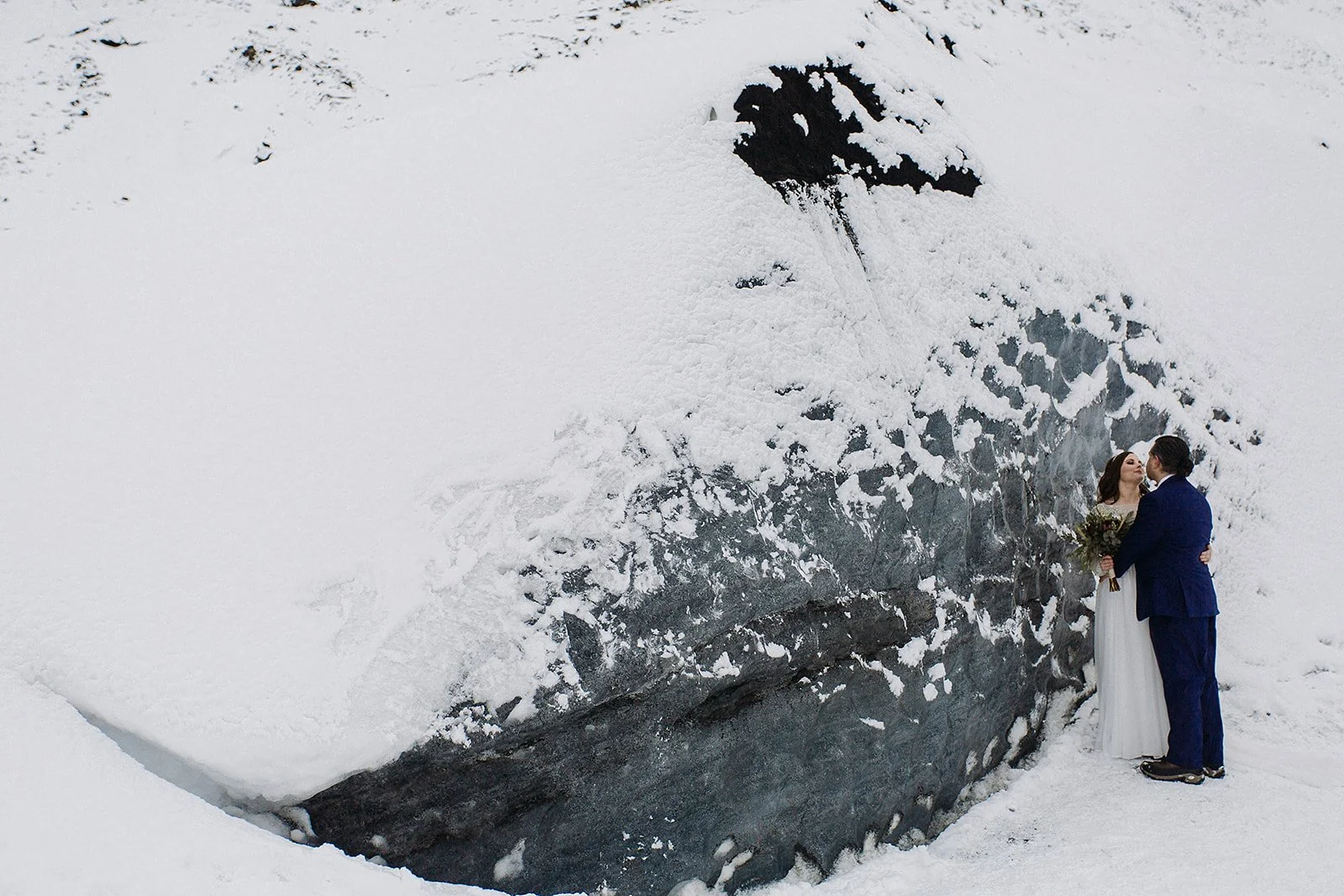 A Winter Iceland Elopement at Skógafoss (Skogafoss) and Glacier — couple at glacier