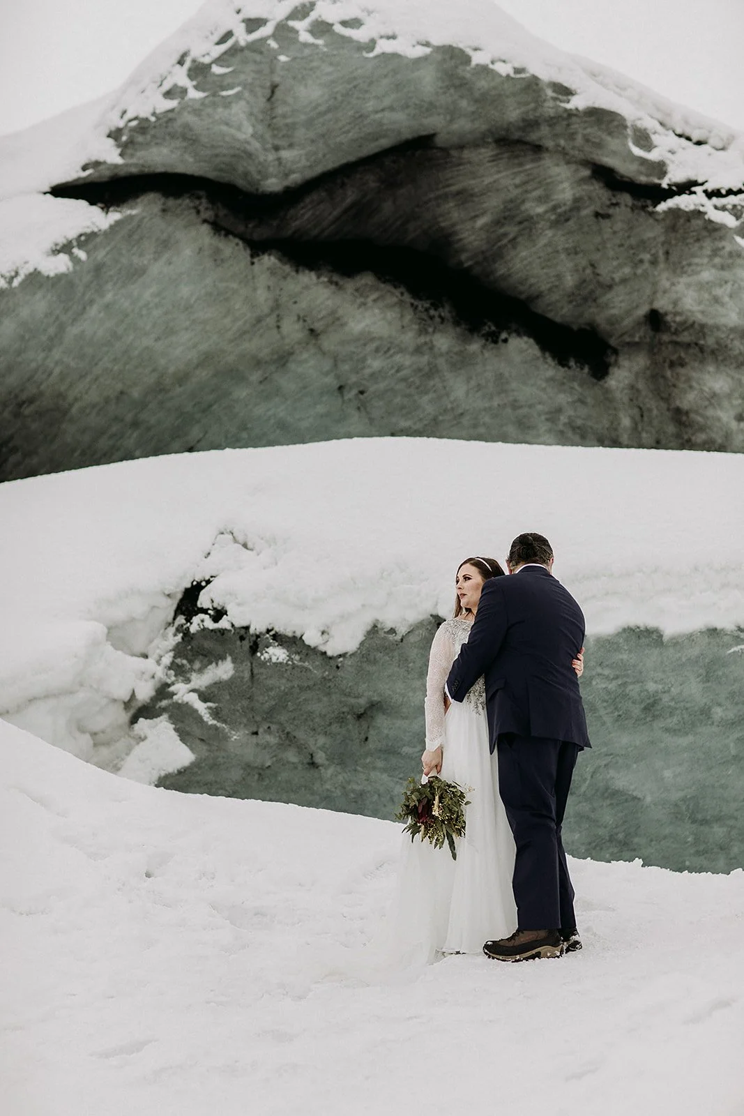 A Winter Iceland Elopement at Skógafoss (Skogafoss) and Glacier — couple at glacier