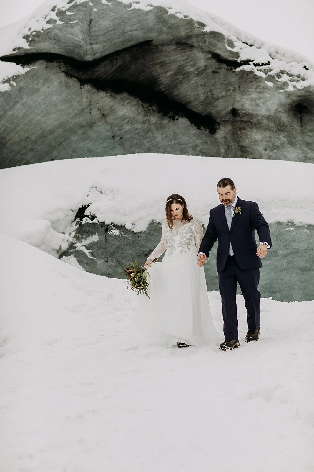 A Winter Iceland Elopement at Skógafoss (Skogafoss) and Glacier — couple at glacier