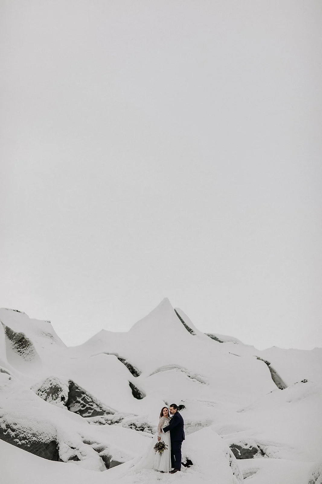 A Winter Iceland Elopement at Skógafoss (Skogafoss) and Glacier — couple at glacier