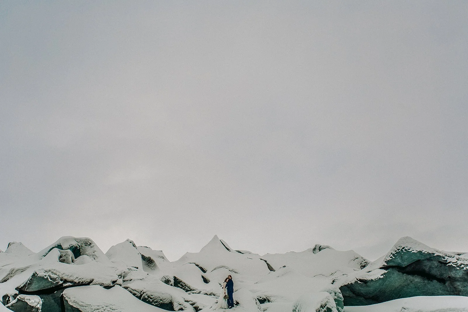 A Winter Iceland Elopement at Skógafoss (Skogafoss) and Glacier — couple at glacier