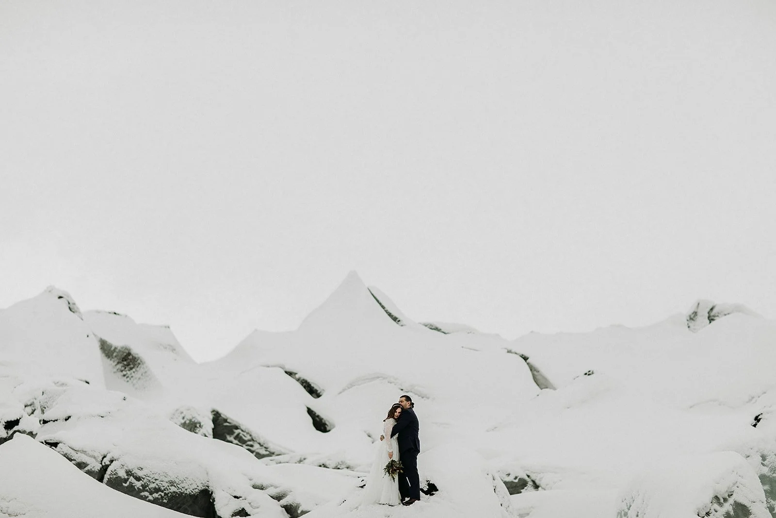 A Winter Iceland Elopement at Skógafoss (Skogafoss) and Glacier — couple at glacier