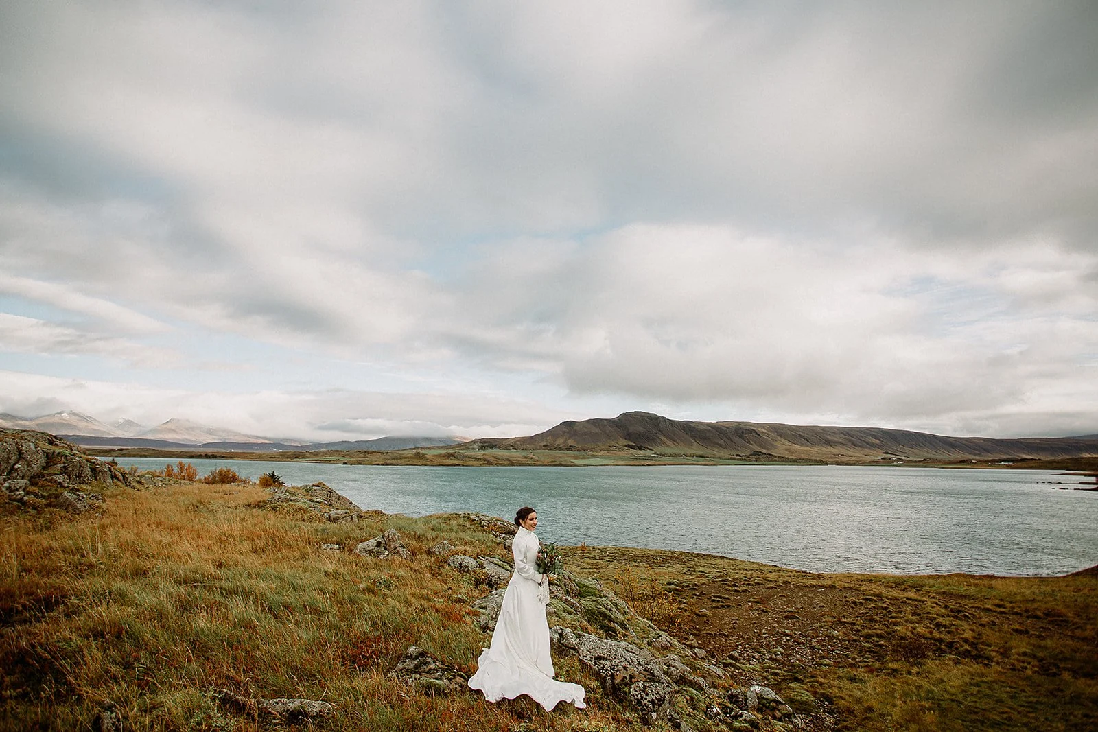 A Private Multi-Area Iceland Elopement by Steph Zakas Photography with wedding couple by fjord