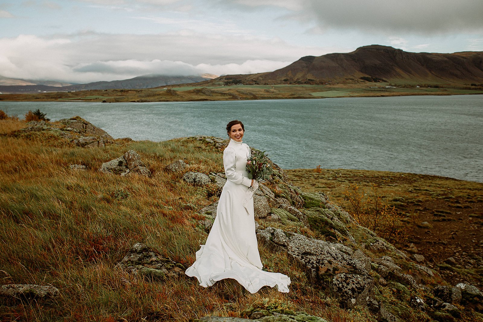 A Private Multi-Area Iceland Elopement by Steph Zakas Photography with wedding couple by fjord