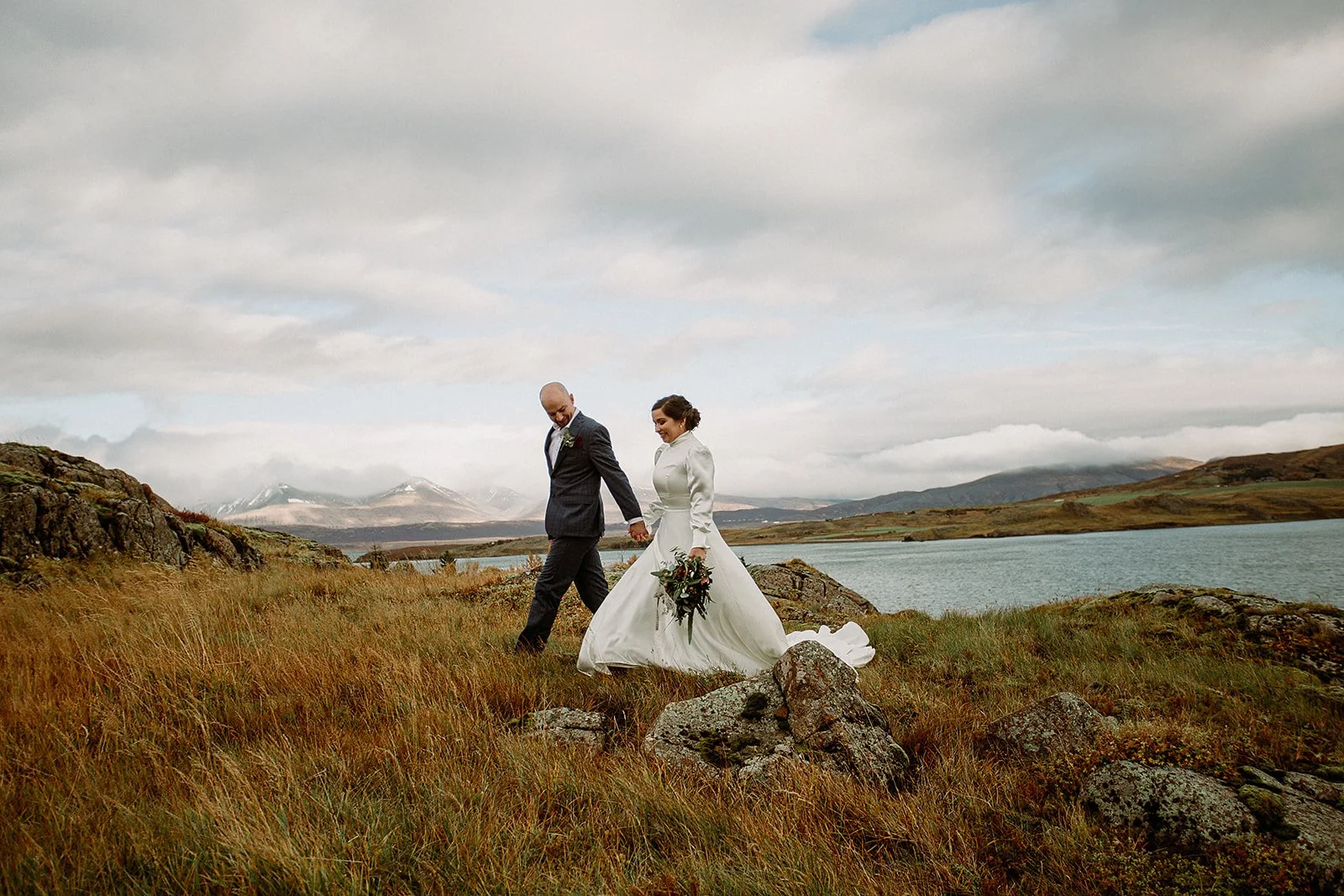 A Private Multi-Area Iceland Elopement by Steph Zakas Photography with wedding couple by fjord