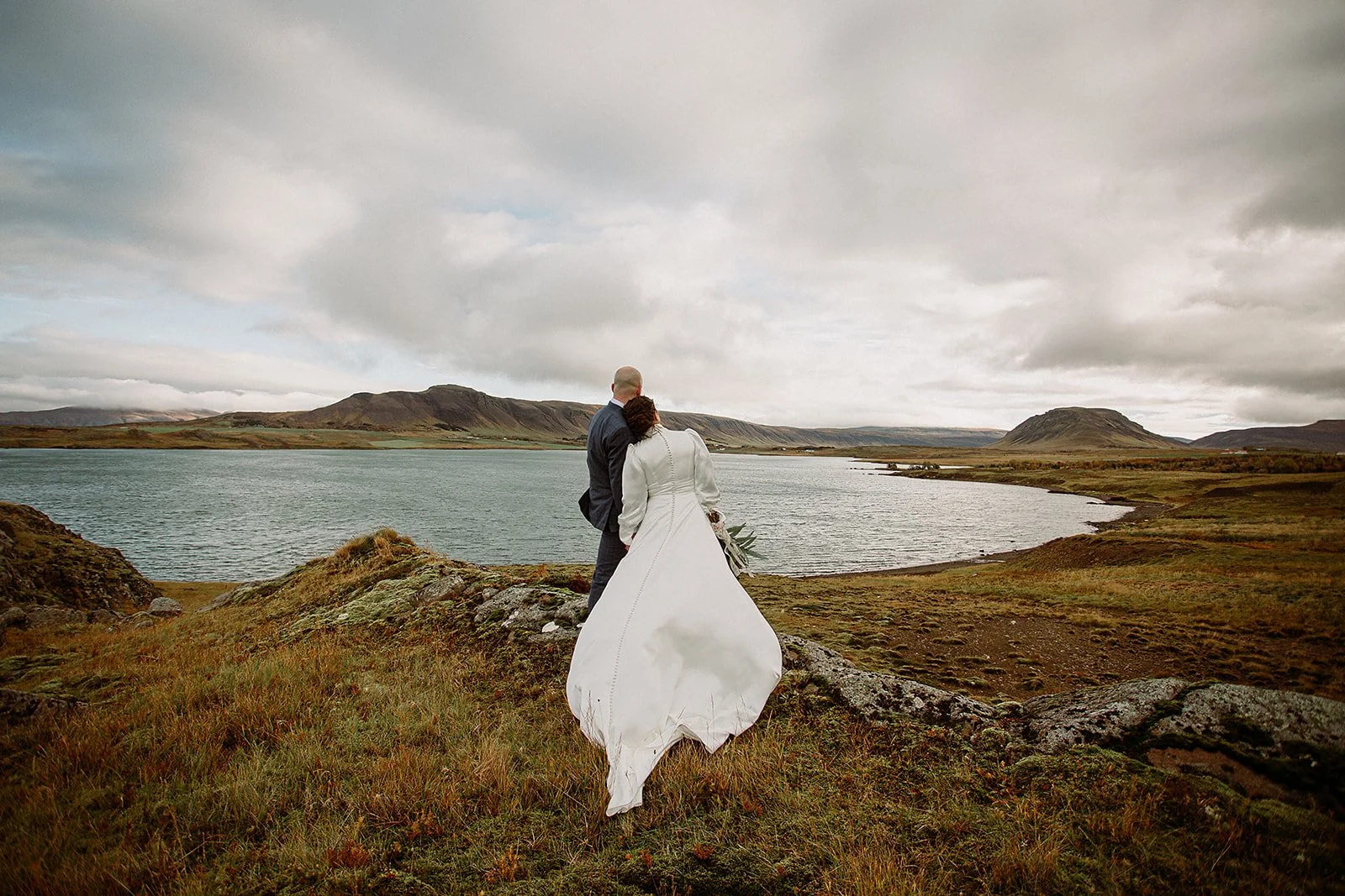 A Private Multi-Area Iceland Elopement by Steph Zakas Photography with wedding couple by fjord