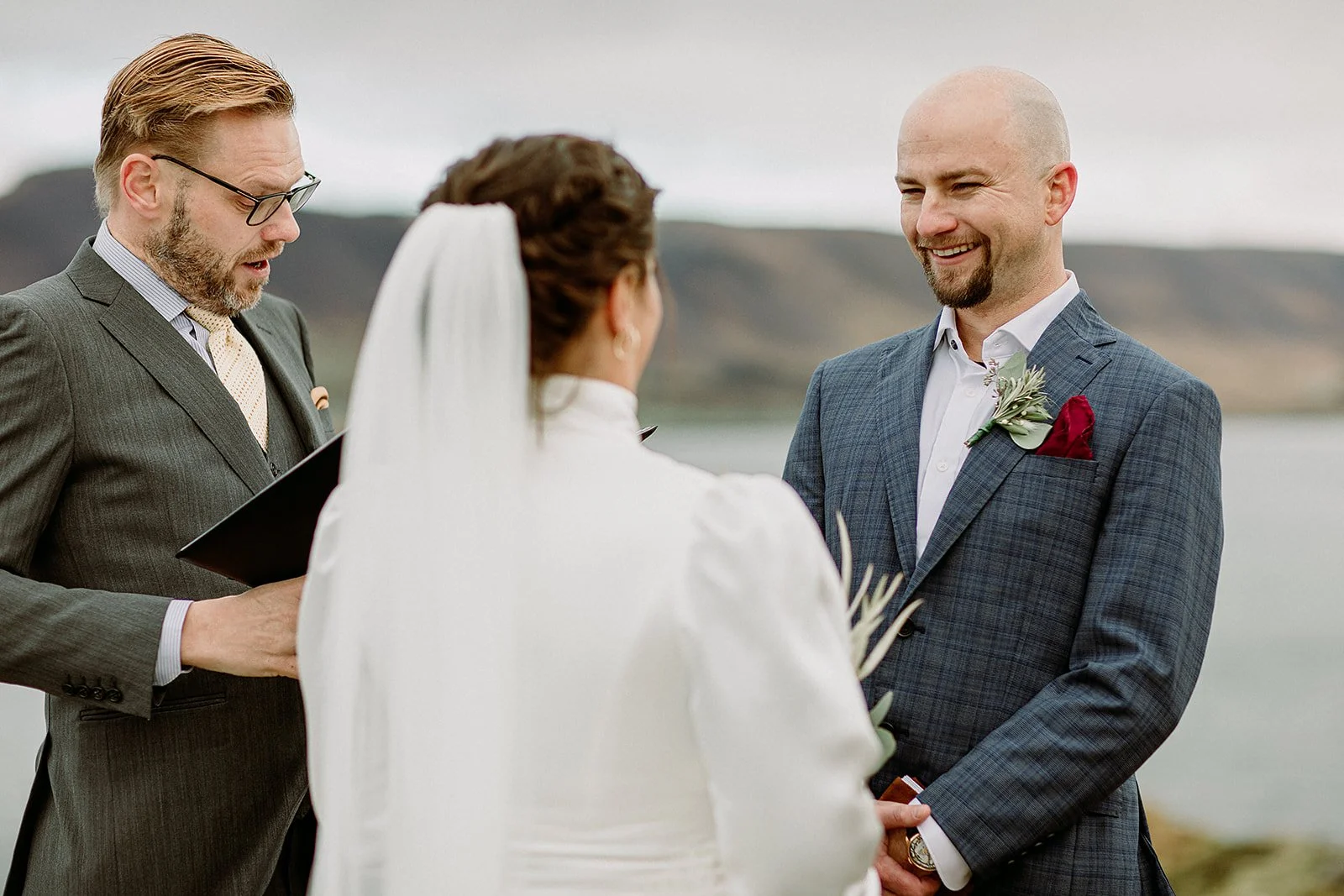 A Private Multi-Area Iceland Elopement by Steph Zakas Photography with wedding couple at private secluded ceremony