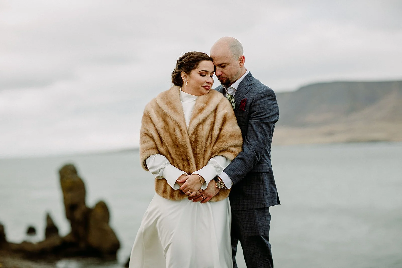 A Private Multi-Area Iceland Elopement by Steph Zakas Photography with wedding couple at fjord