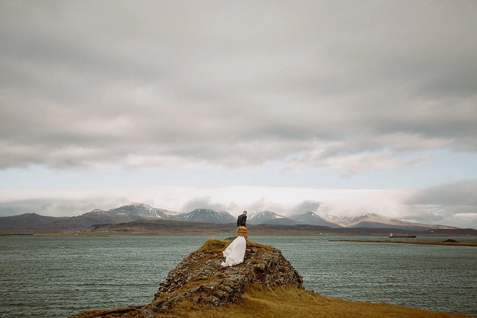 A Private Multi-Area Iceland Elopement by Steph Zakas Photography with wedding couple at fjord