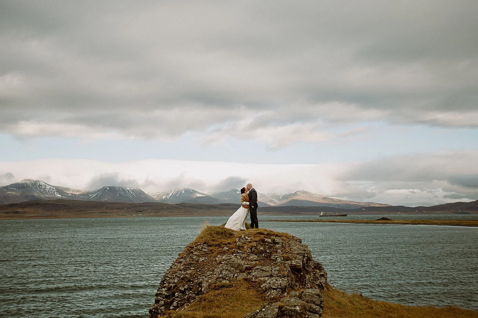 A Private Multi-Area Iceland Elopement by Steph Zakas Photography with wedding couple at fjord