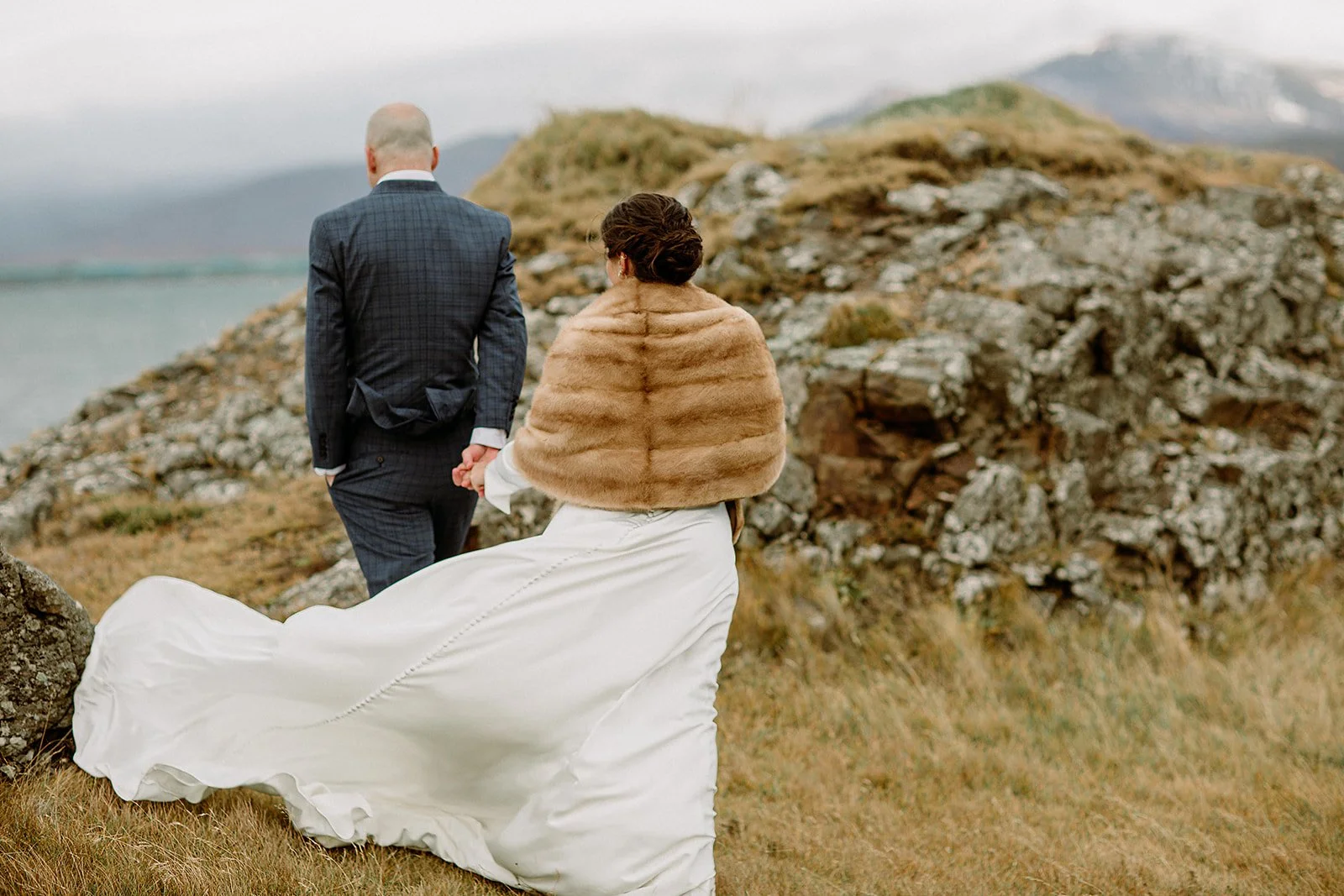 A Private Multi-Area Iceland Elopement by Steph Zakas Photography with wedding couple at fjord