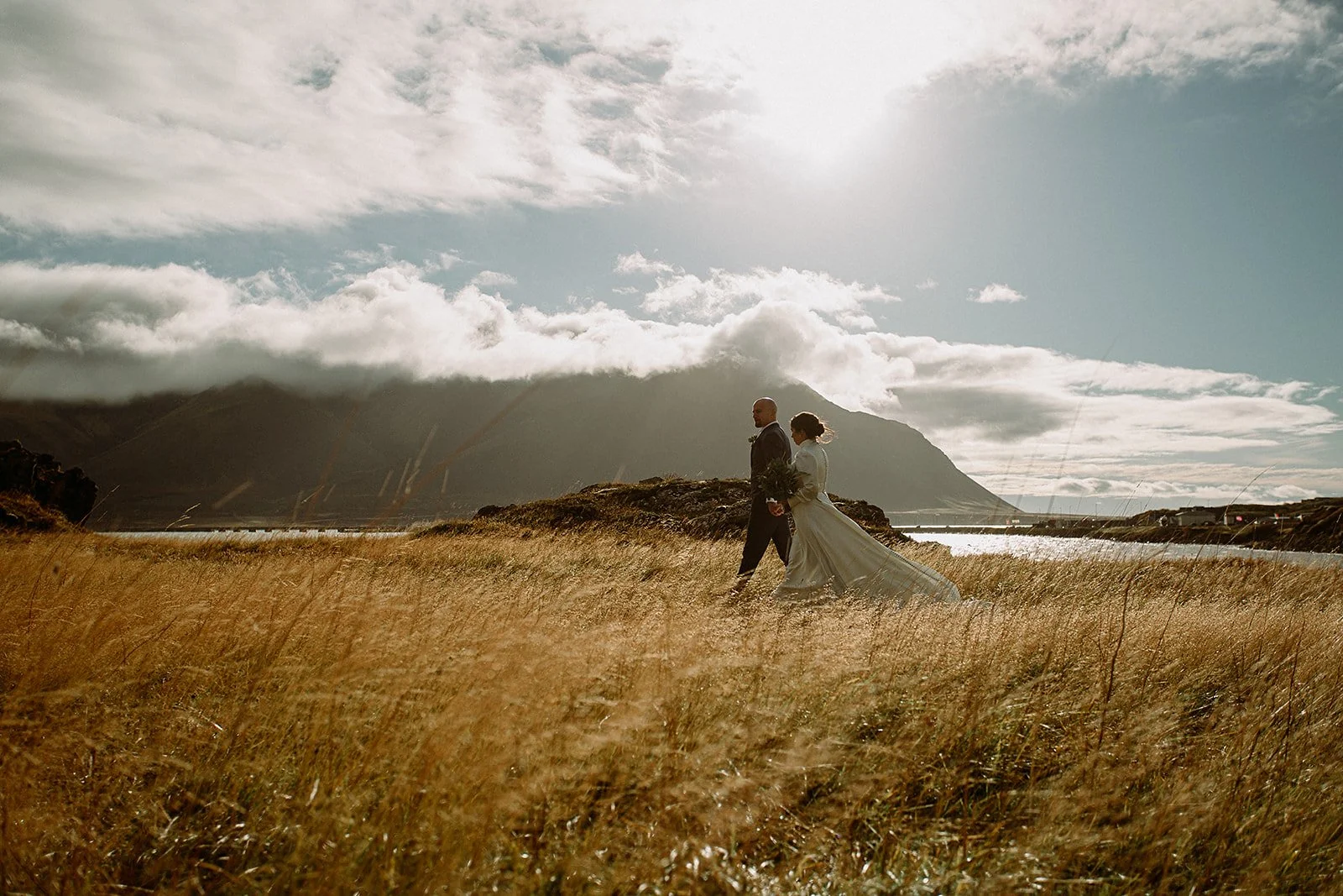 A Private Multi-Area Iceland Elopement by Steph Zakas Photography with wedding couple at fjord