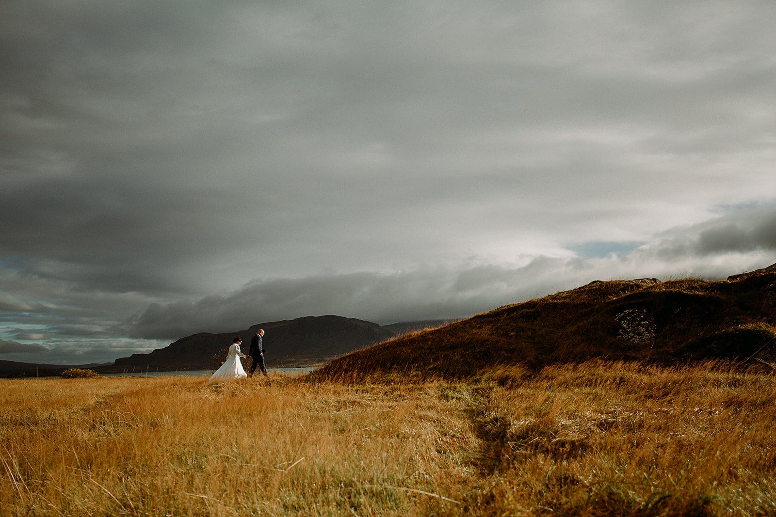 A Private Multi-Area Iceland Elopement by Steph Zakas Photography with wedding couple at fjord
