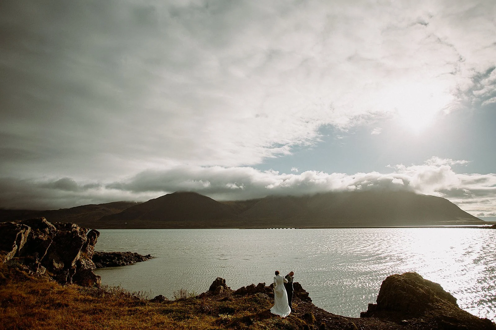 A Private Multi-Area Iceland Elopement by Steph Zakas Photography with wedding couple at fjord