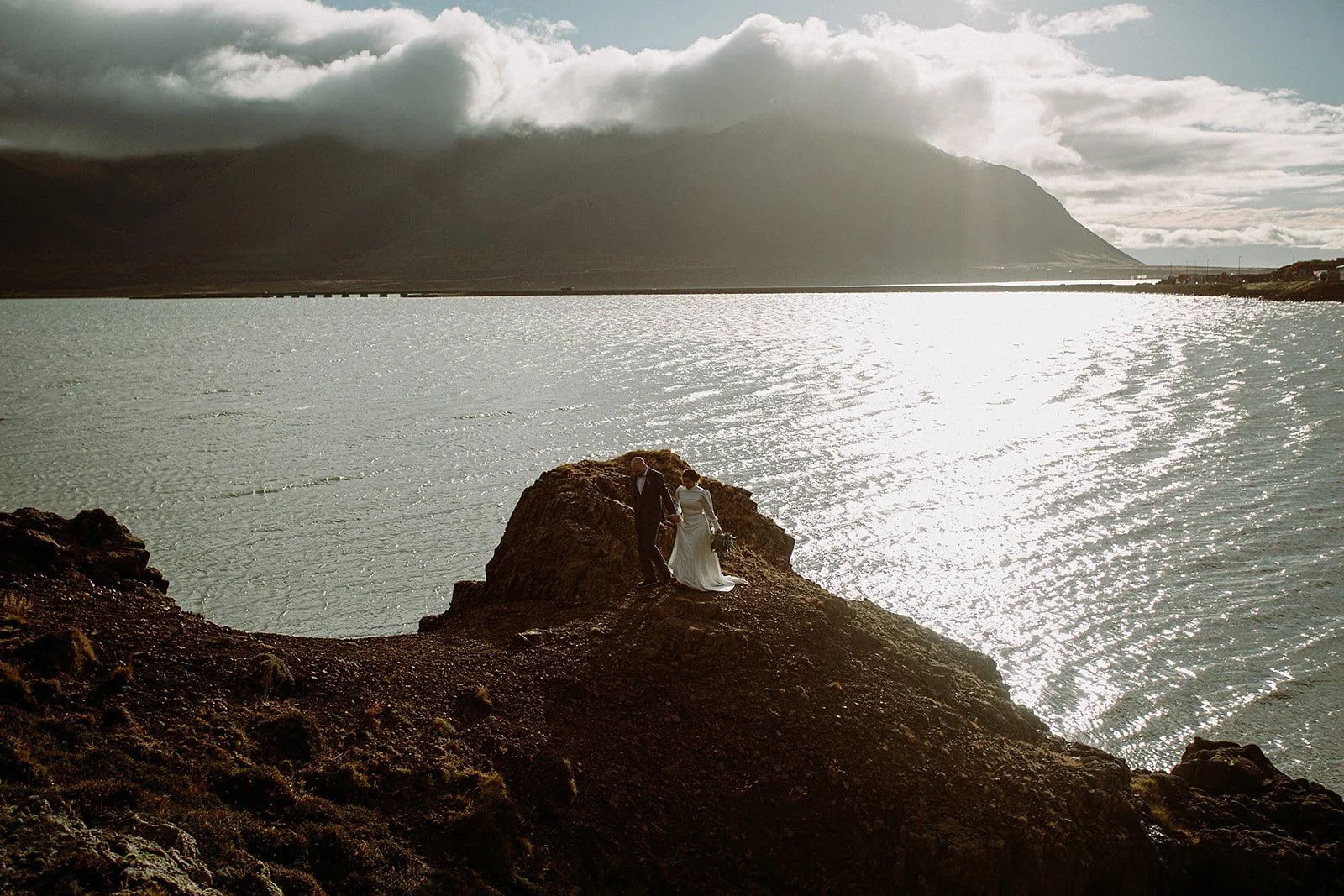 A Private Multi-Area Iceland Elopement by Steph Zakas Photography with wedding couple at fjord