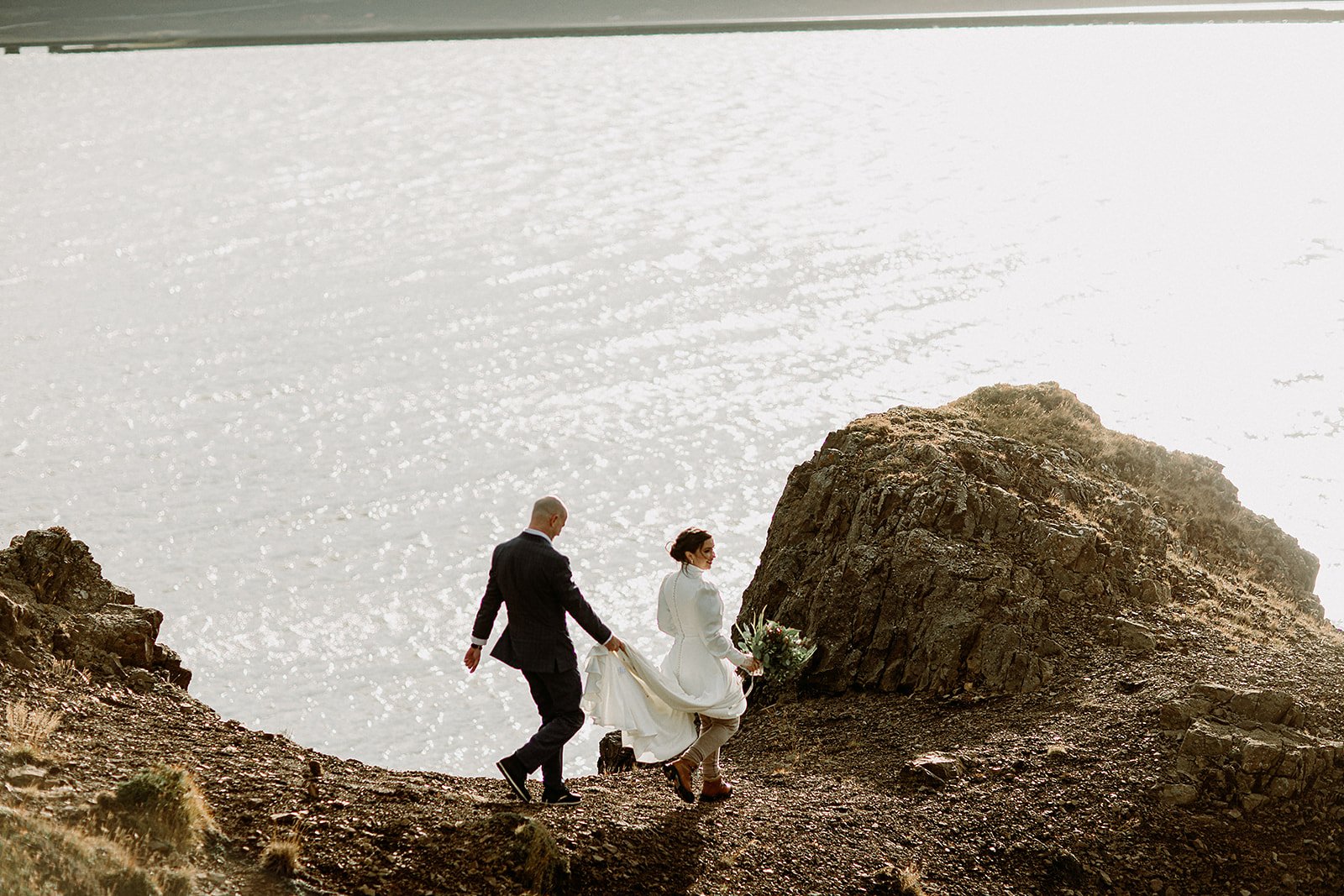 A Private Multi-Area Iceland Elopement by Steph Zakas Photography with wedding couple at fjord