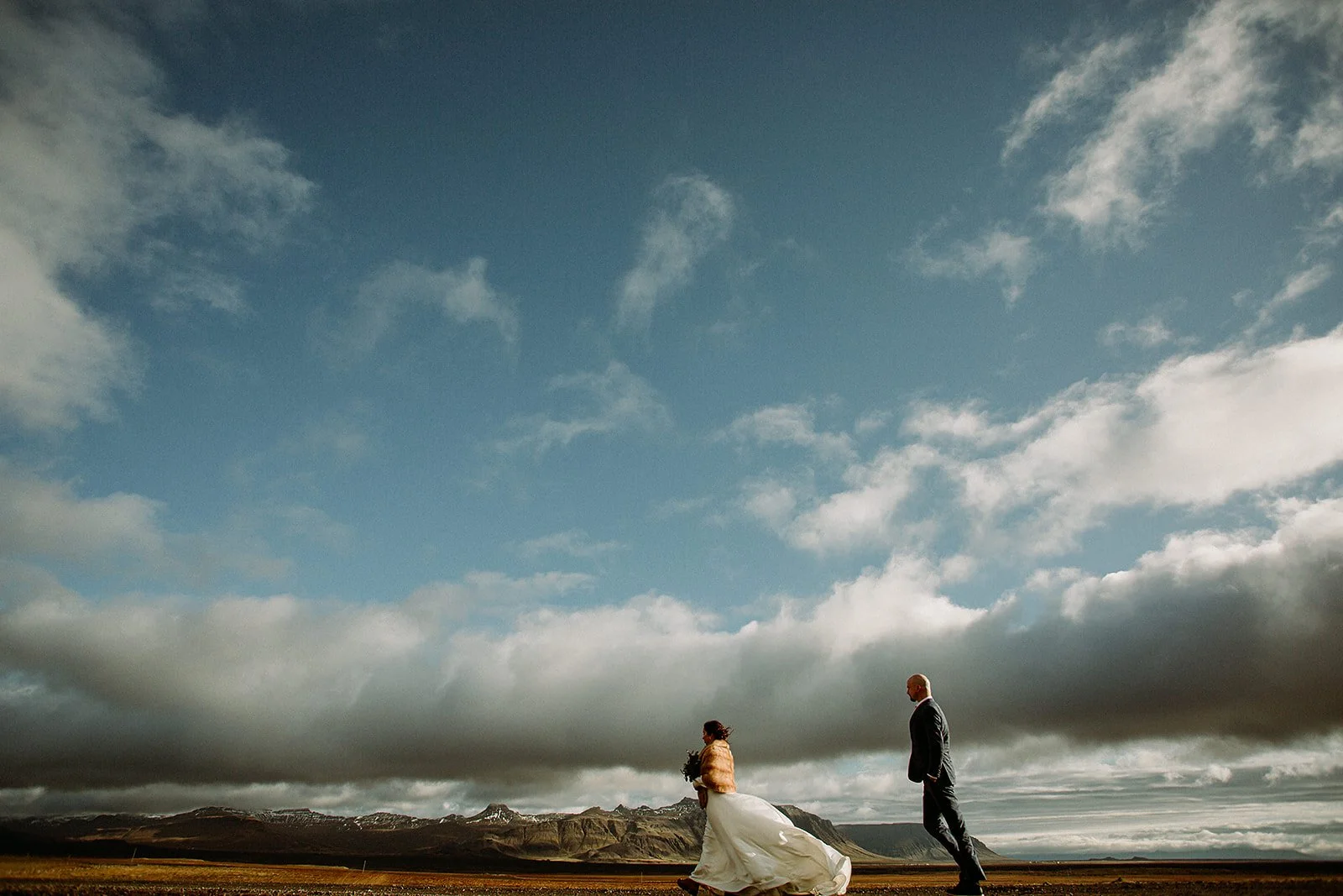 A Private Multi-Area Iceland Elopement by Steph Zakas Photography with wedding couple at fjord