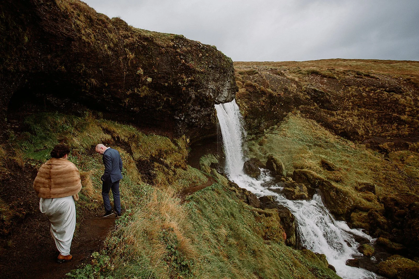 A Private Multi-Area Iceland Elopement by Steph Zakas Photography with wedding couple at secluded waterfall