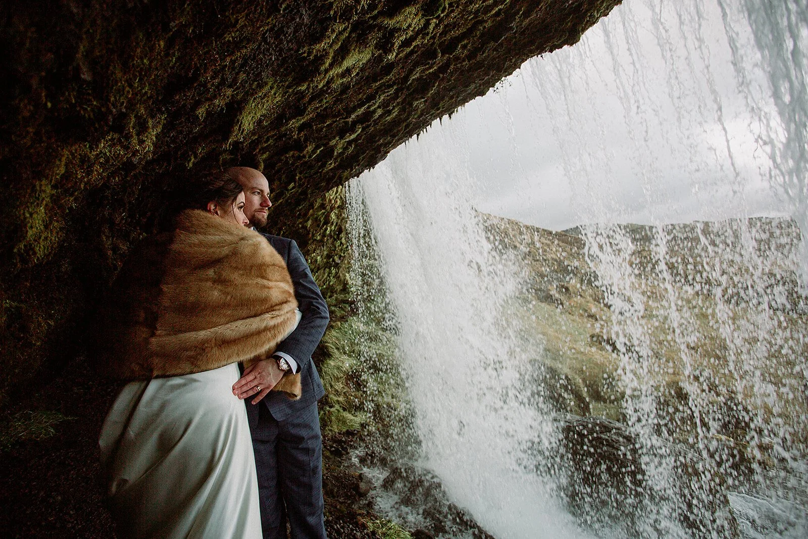 A Private Multi-Area Iceland Elopement by Steph Zakas Photography with wedding couple at secluded waterfall