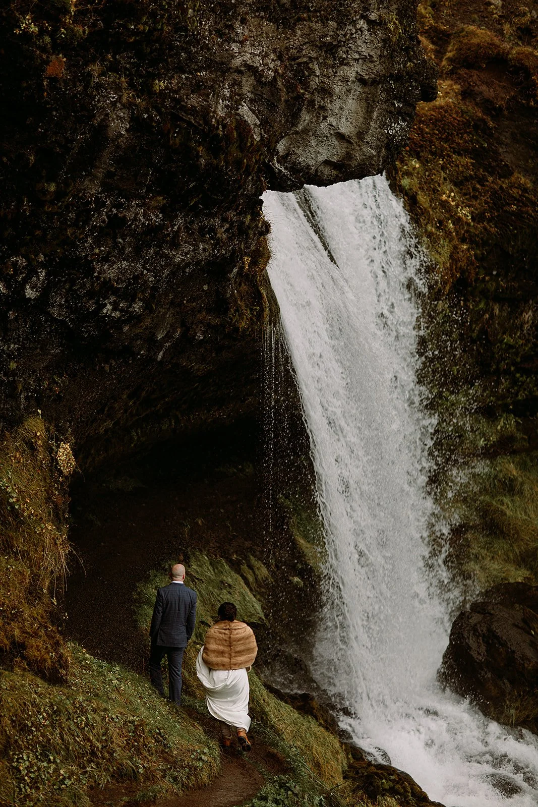 A Private Multi-Area Iceland Elopement by Steph Zakas Photography with wedding couple at secluded waterfall