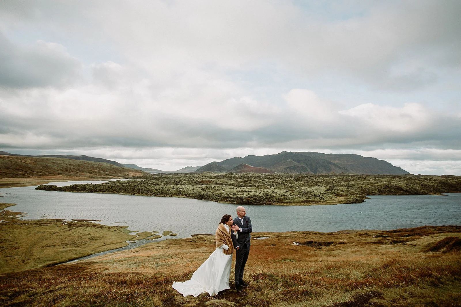 A Private Multi-Area Iceland Elopement by Steph Zakas Photography with wedding couple at secluded waterfall